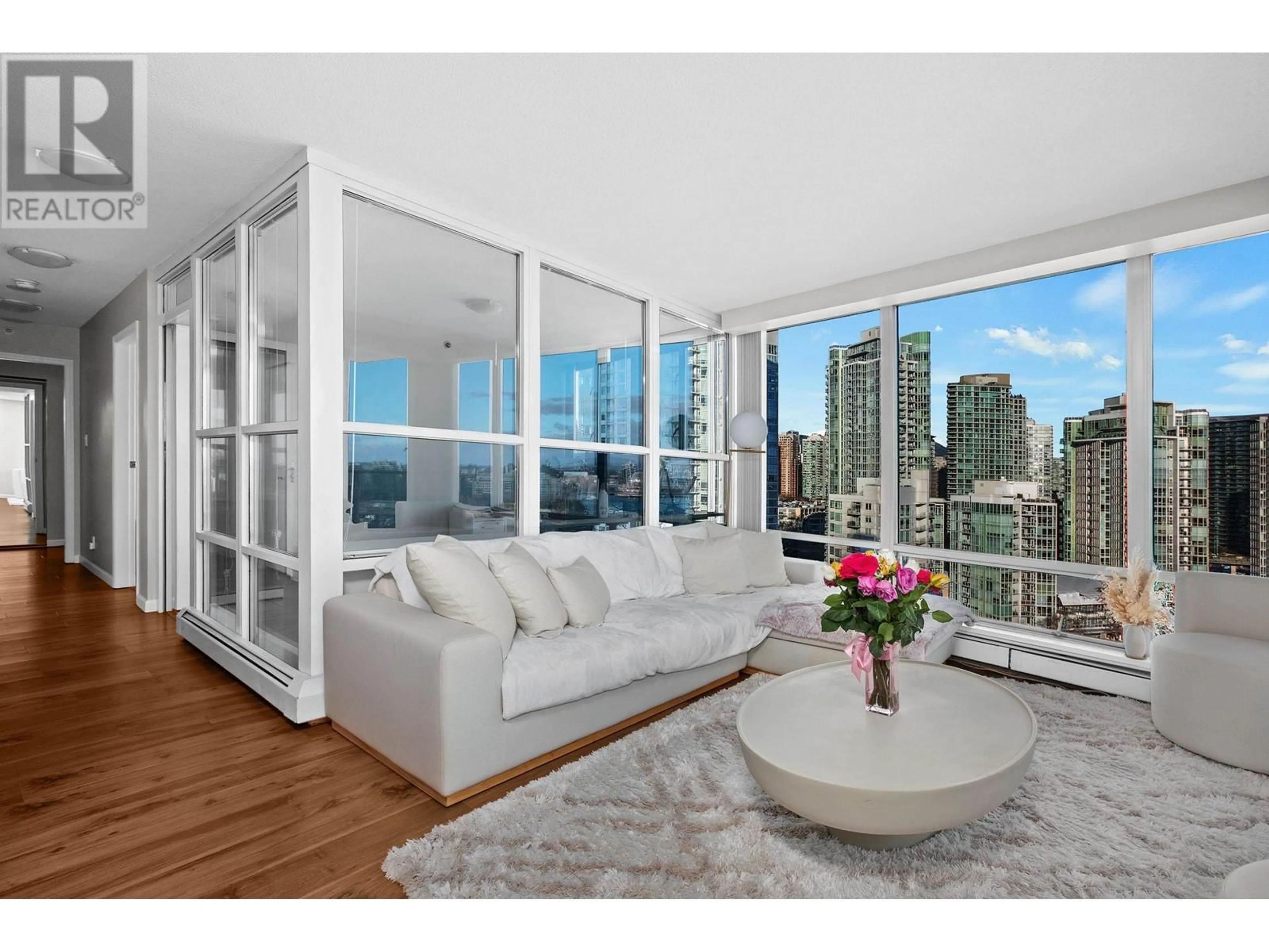 Living room with furniture, wood/laminate floor for 1901 - 1228 MARINASIDE CRESCENT, Vancouver British Columbia V5S2L7