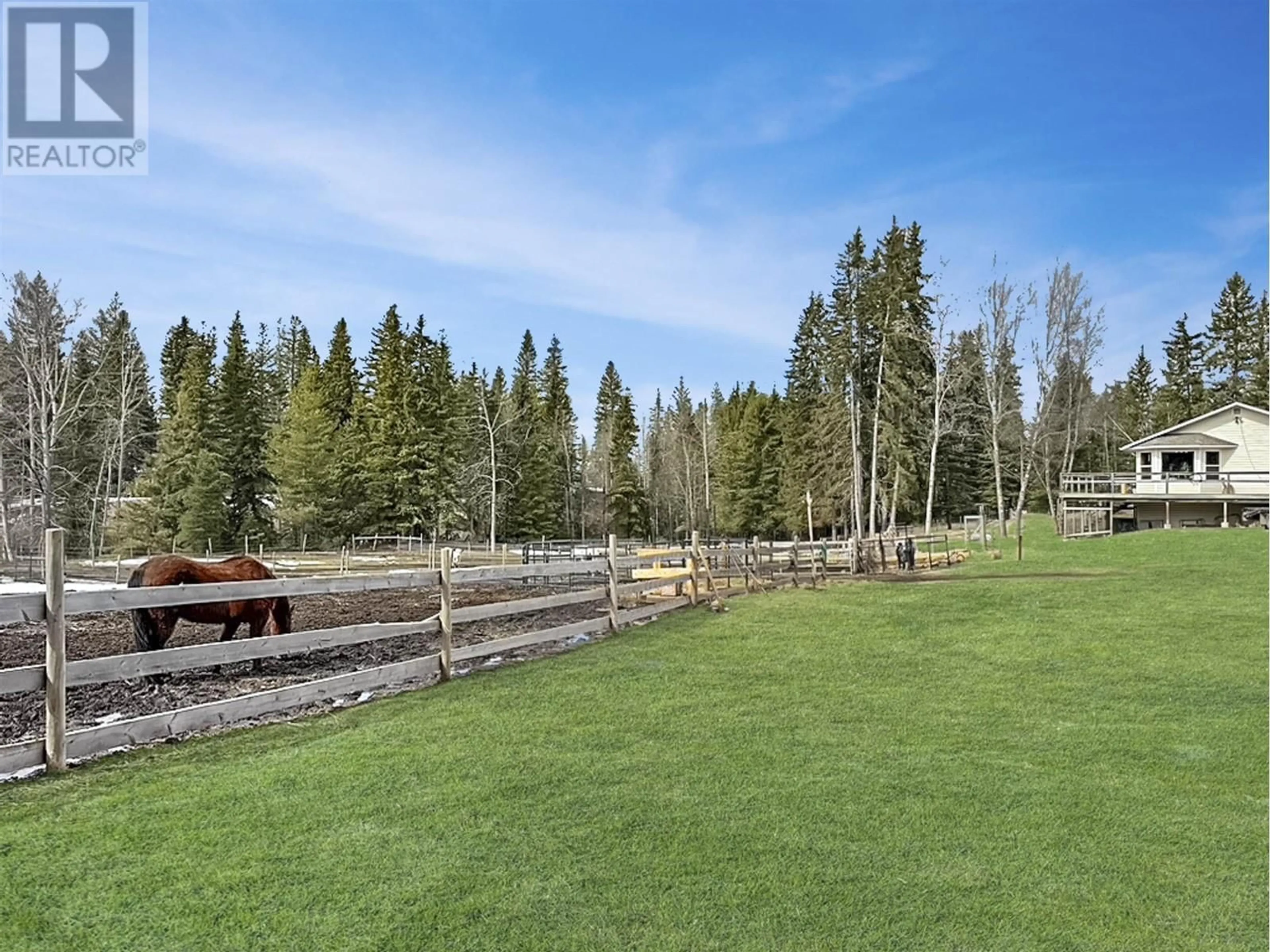 A pic from outside/outdoor area/front of a property/back of a property/a pic from drone, forest/trees view for 3736 SPOKIN LAKE ROAD, 150 Mile House British Columbia V0K2G0