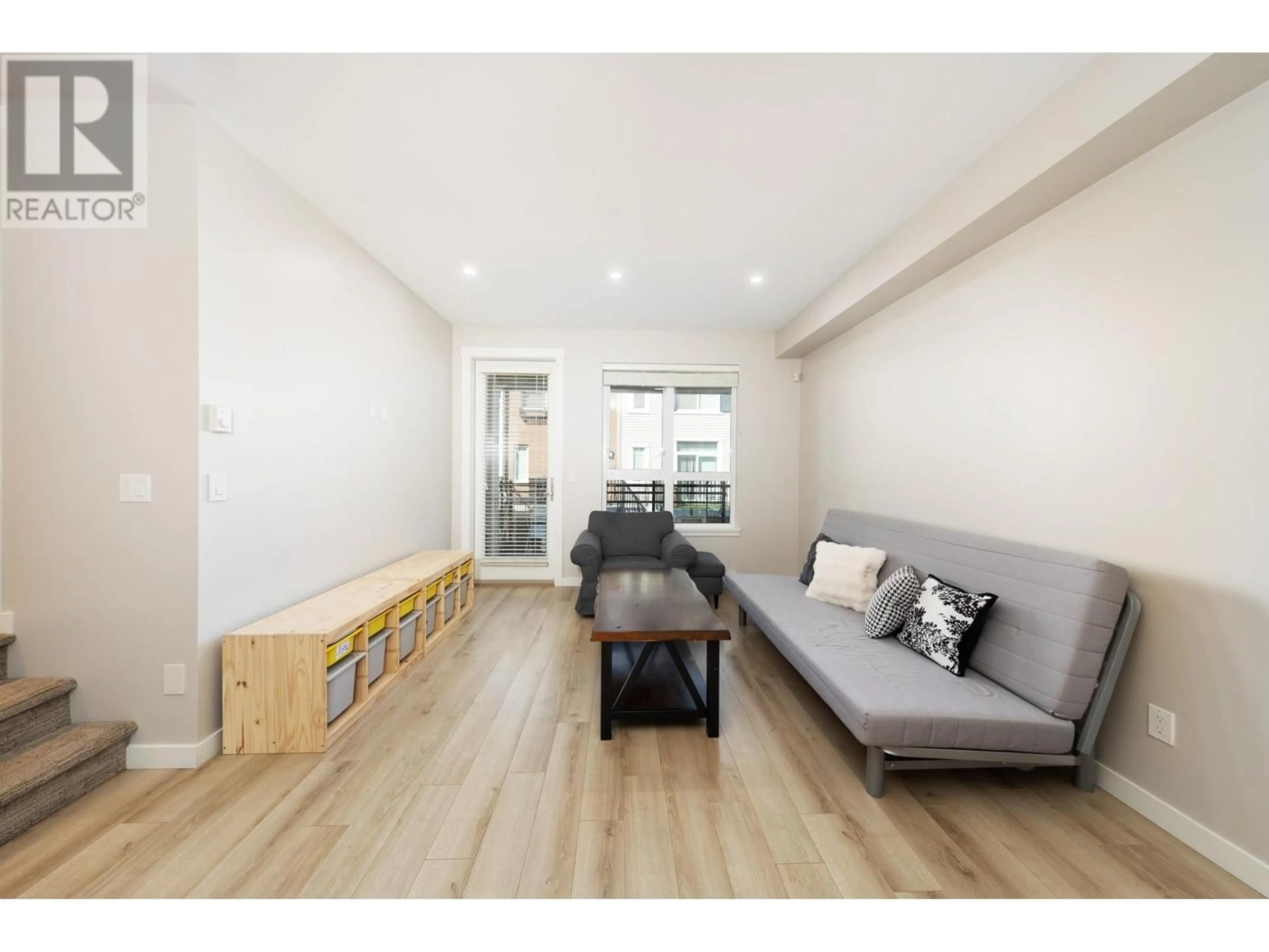 Living room with furniture, wood/laminate floor for 109 - 9671 ALBERTA ROAD, Richmond British Columbia V6Y1T7
