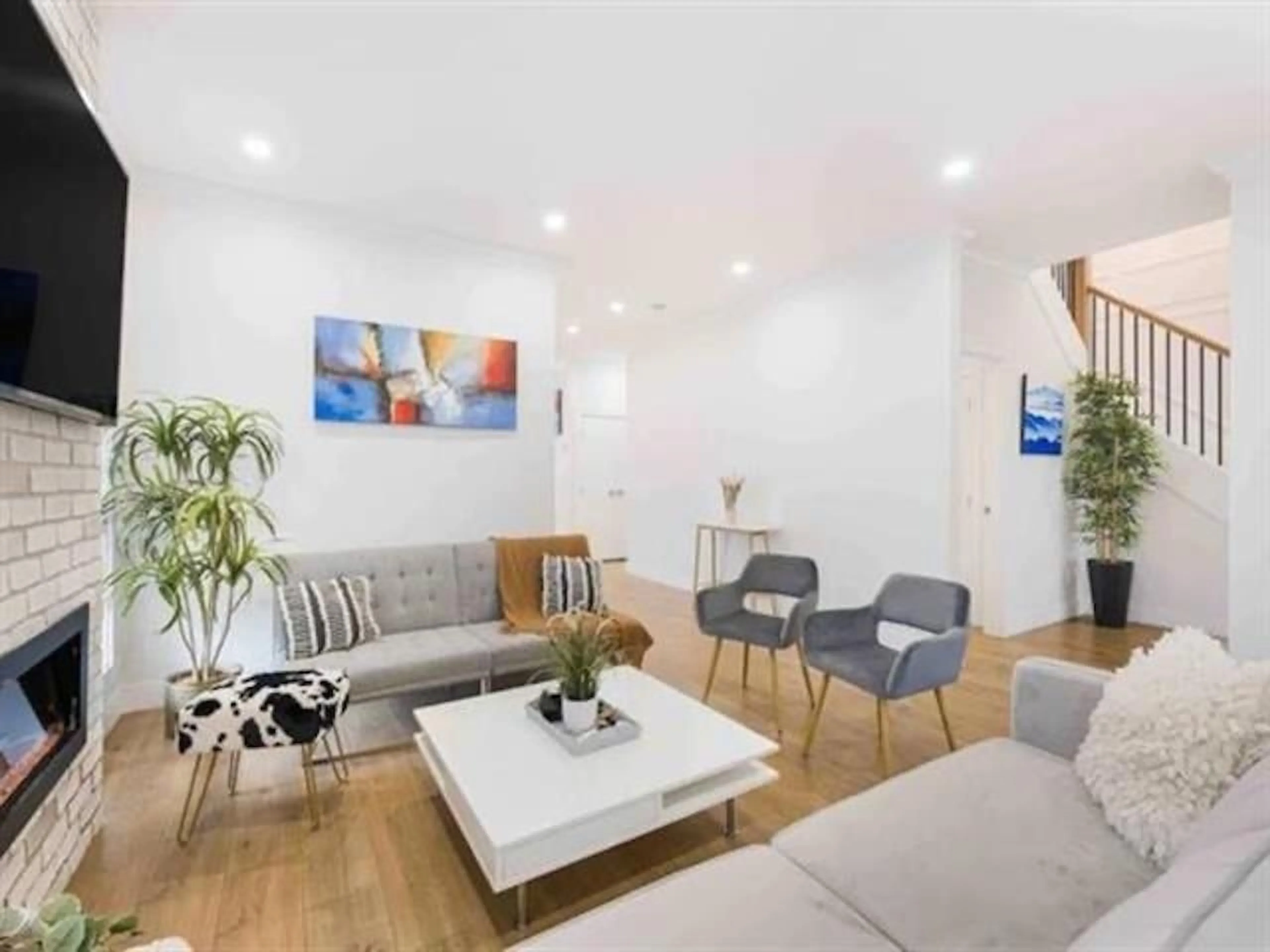 Living room with furniture, wood/laminate floor for 6709 216, Langley British Columbia V2Y0W9
