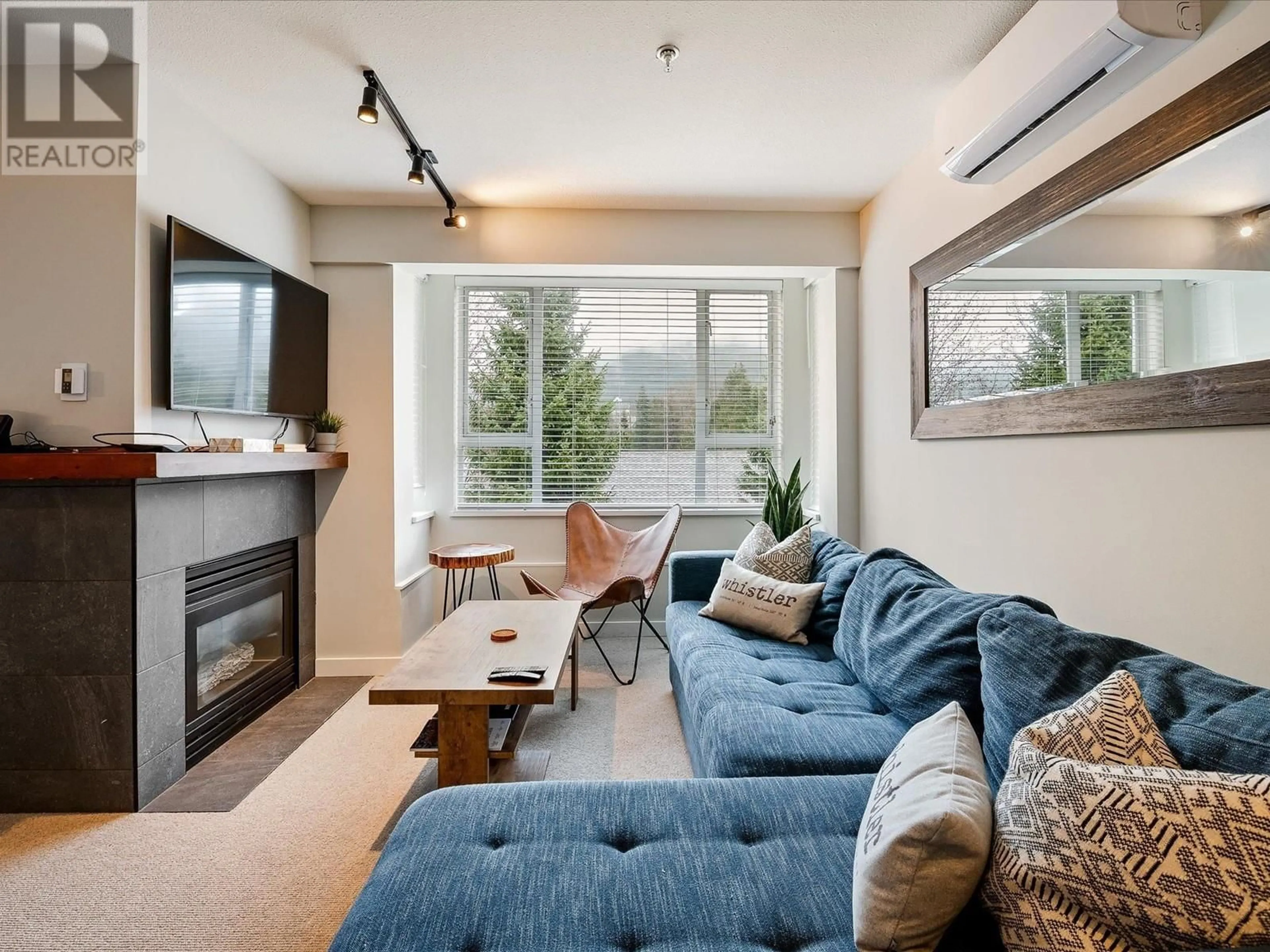 Living room with furniture, wood/laminate floor for 401 - 4314 MAIN STREET, Whistler British Columbia V8E1A8