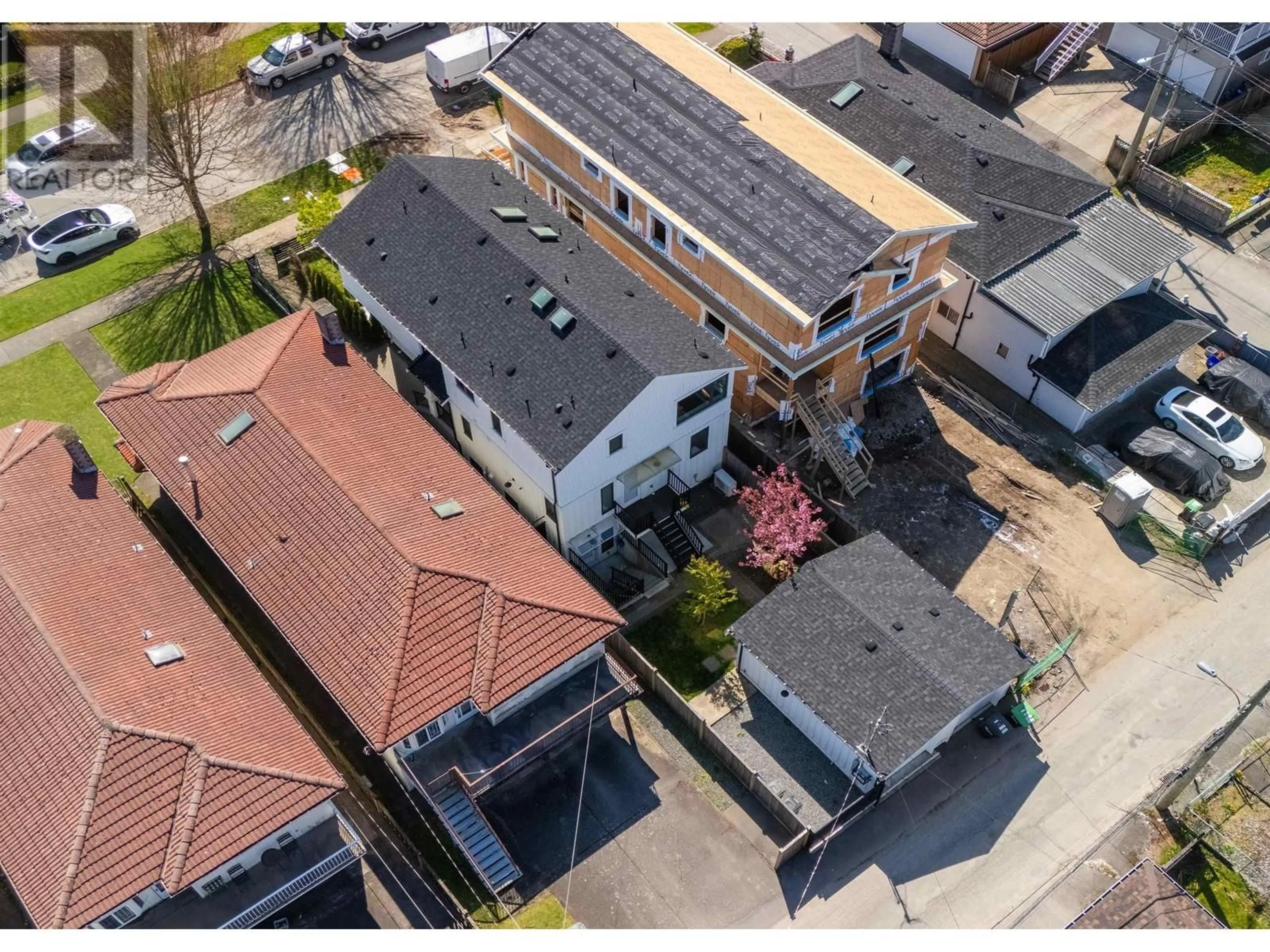 A pic from outside/outdoor area/front of a property/back of a property/a pic from drone, street for 2045 E 51 AVENUE, Vancouver British Columbia V5P1W2