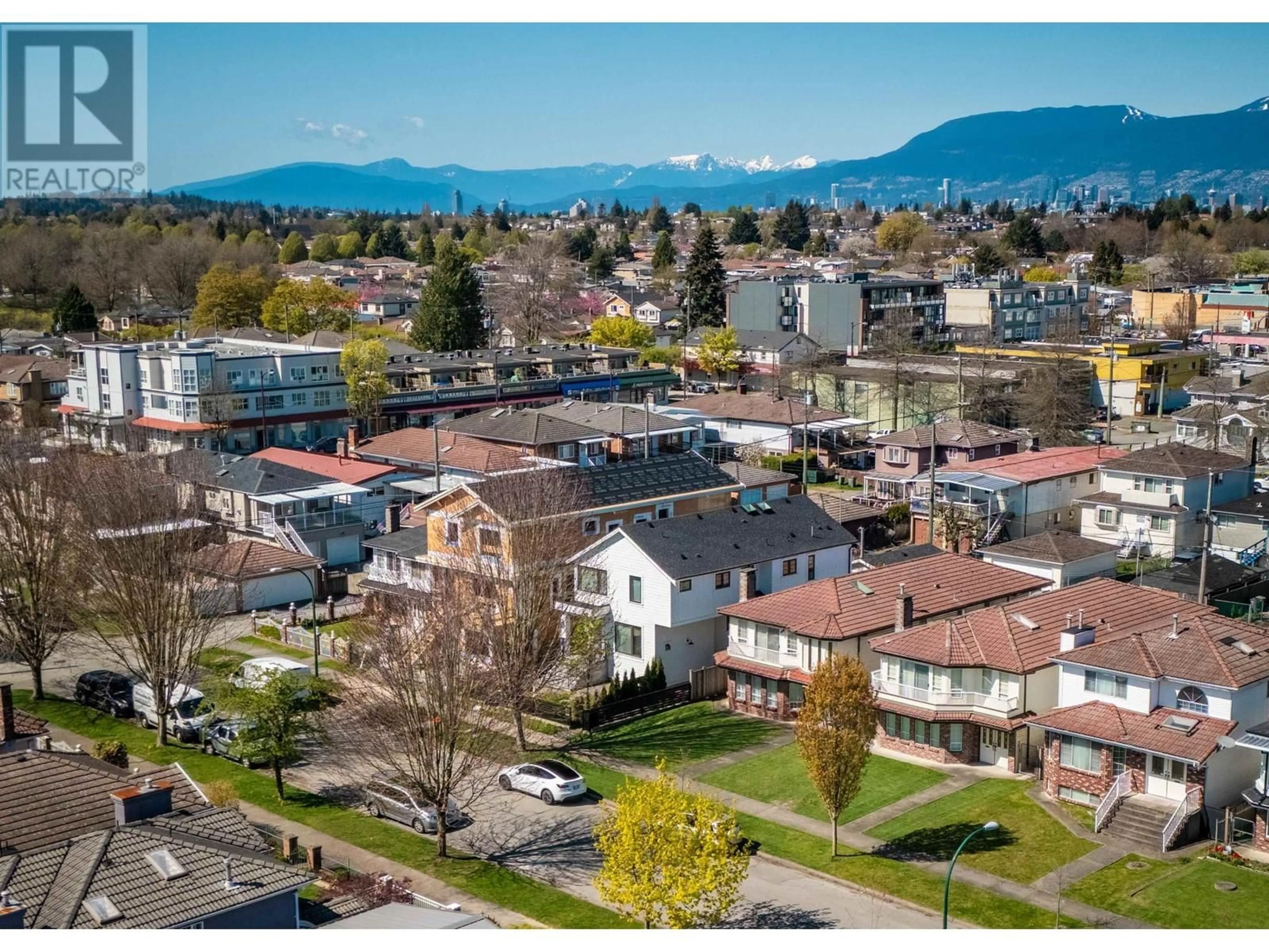 A pic from outside/outdoor area/front of a property/back of a property/a pic from drone, mountain view for 2047 E 51 AVENUE, Vancouver British Columbia V5P1W2