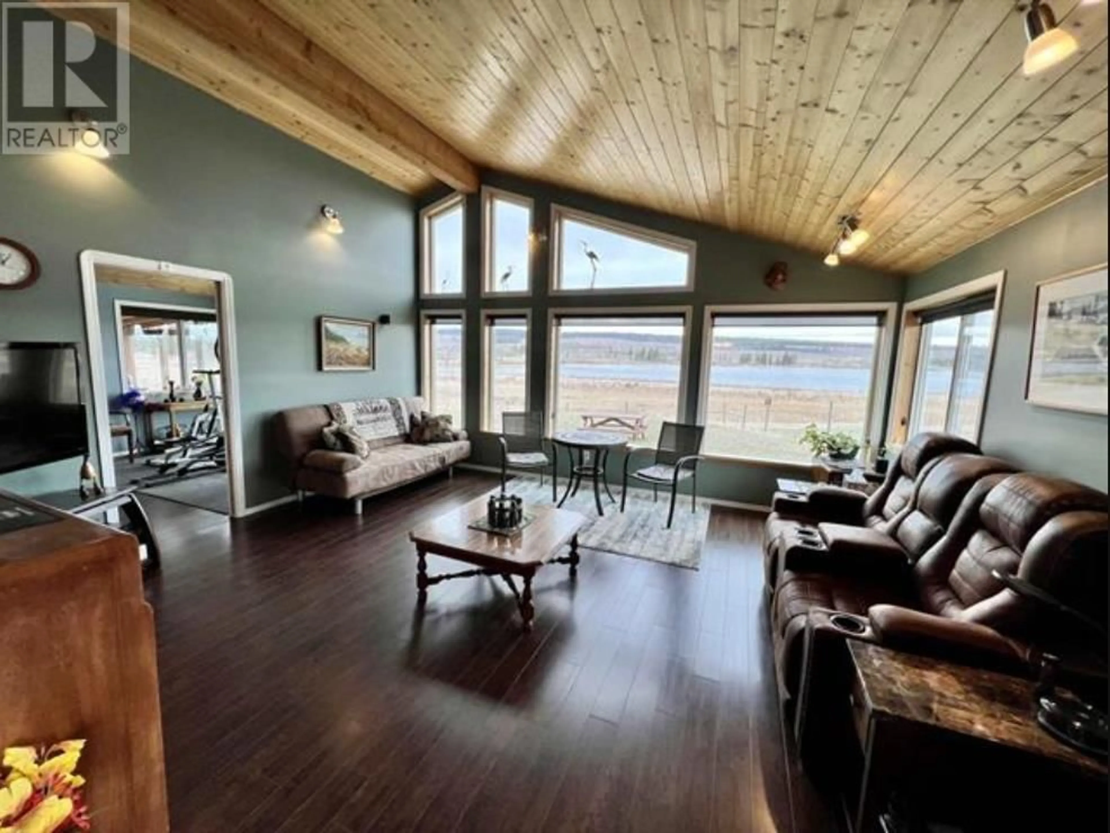 Living room with furniture, wood/laminate floor for 5028 ABEL LAKE ROAD, 100 Mile House British Columbia V0K2E1
