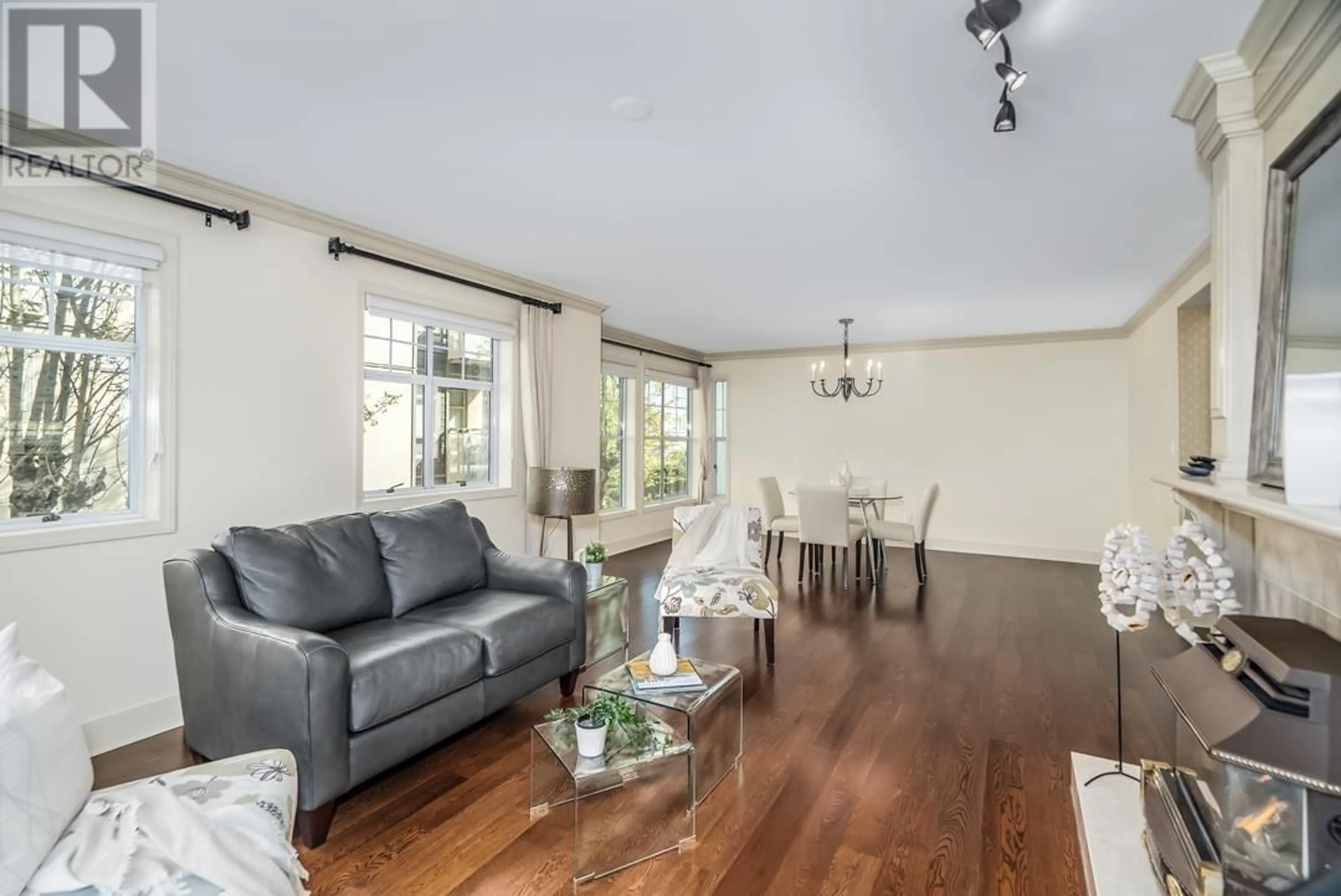 Living room with furniture, wood/laminate floor for 212 - 1150 54A STREET, Delta British Columbia V4M4B5