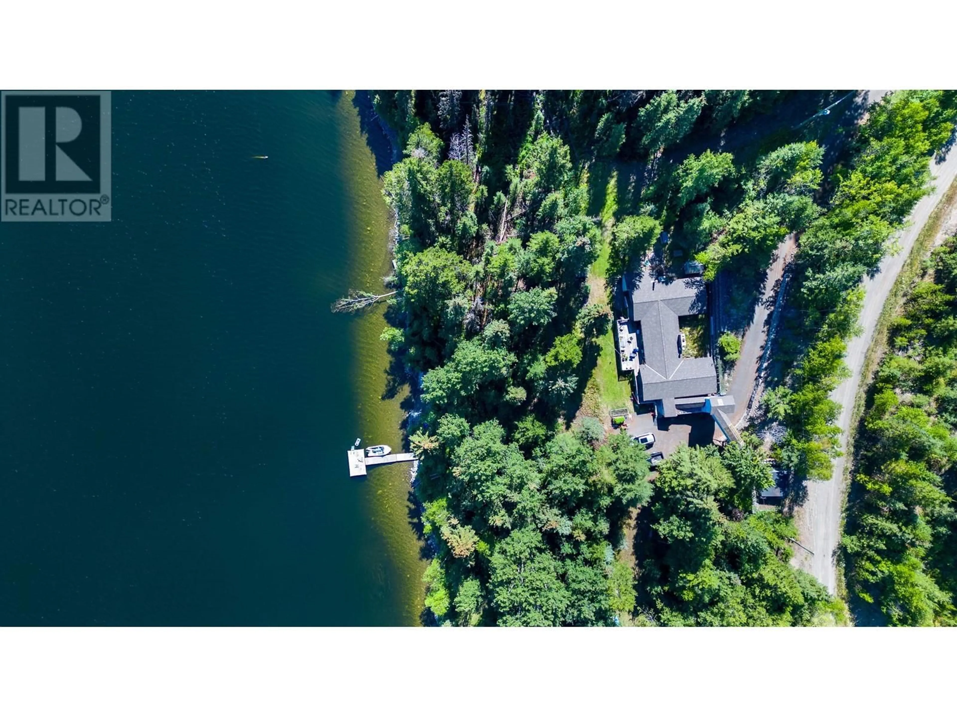 A pic from outside/outdoor area/front of a property/back of a property/a pic from drone, water/lake/river/ocean view for 6088 NORMAN ROAD, 100 Mile House British Columbia V0K2E3