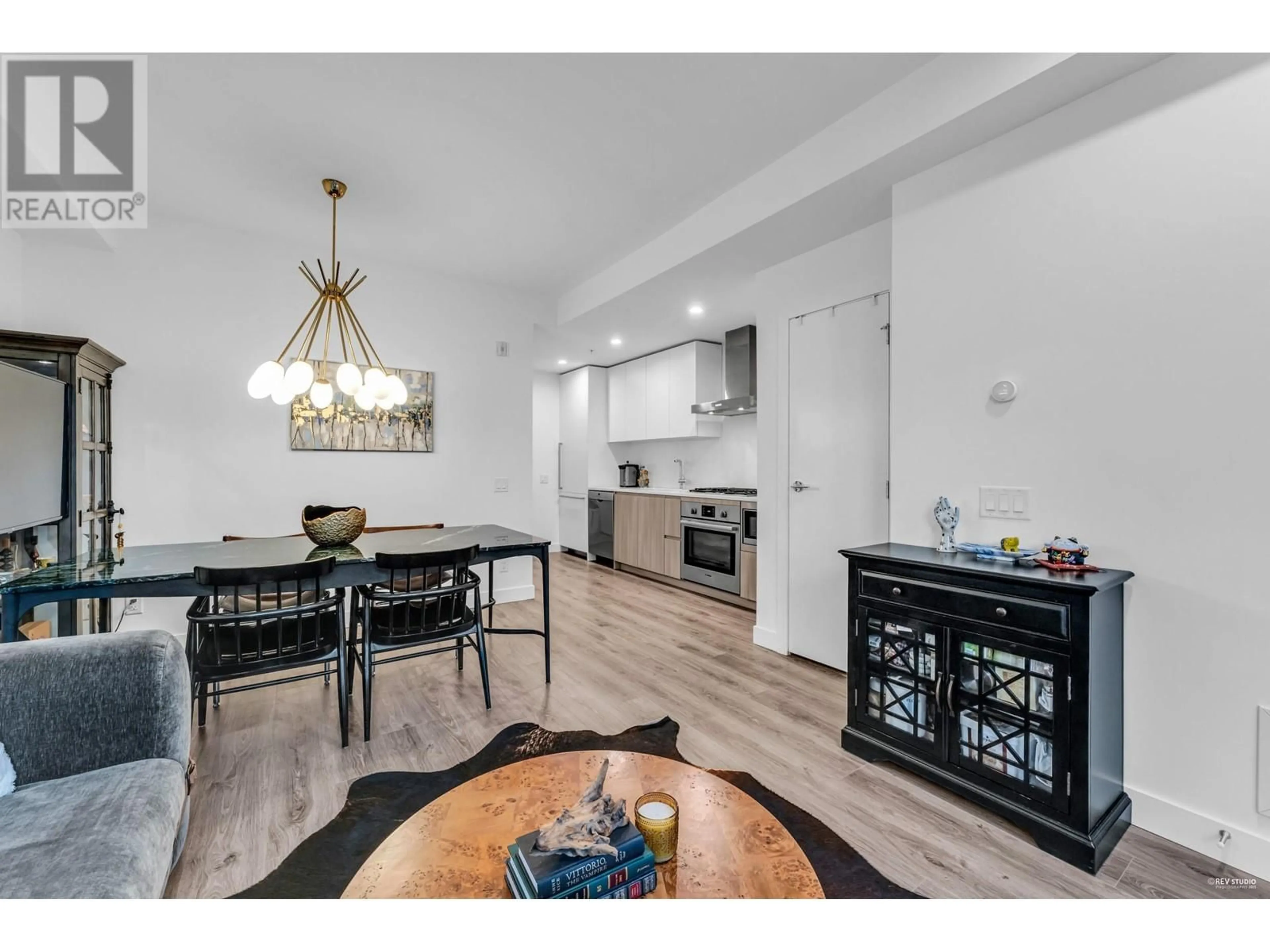 Open concept kitchen, wood/laminate floor for 129 - 2060 CURLING ROAD, North Vancouver British Columbia V7P0C6