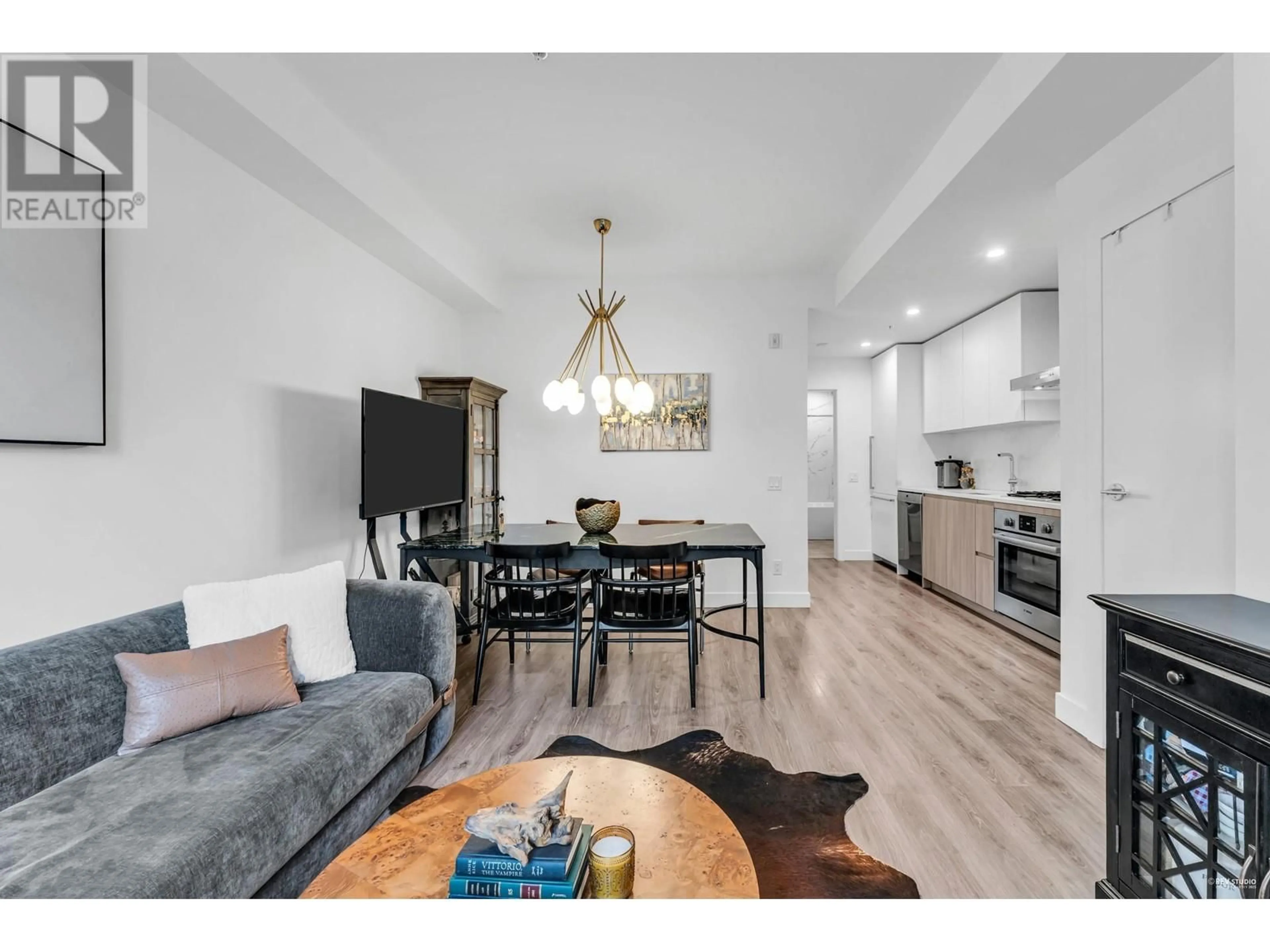 Open concept kitchen, wood/laminate floor for 129 - 2060 CURLING ROAD, North Vancouver British Columbia V7P0C6