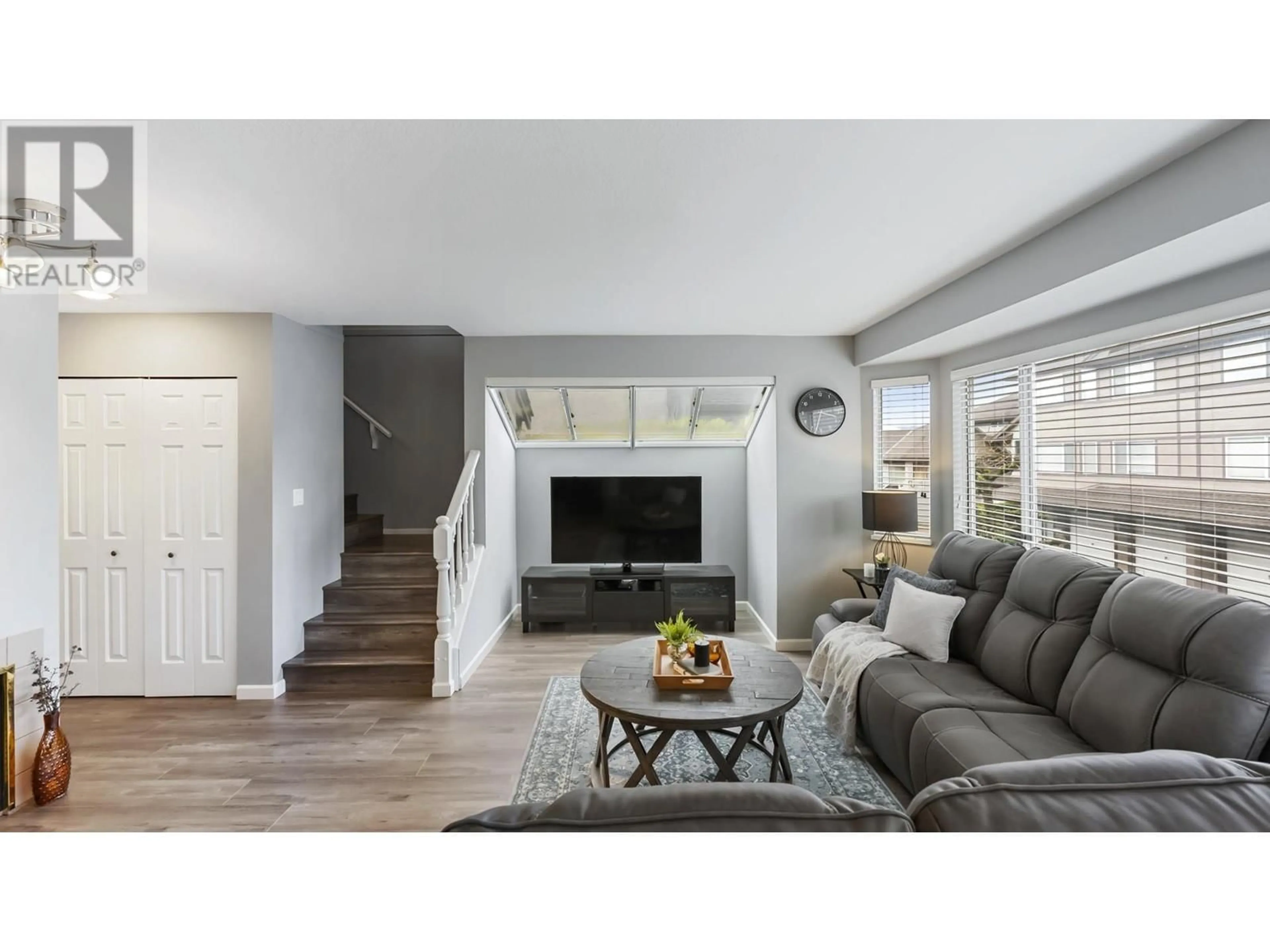 Living room with furniture, wood/laminate floor for 68 - 5380 SMITH DRIVE, Richmond British Columbia V6V2K8