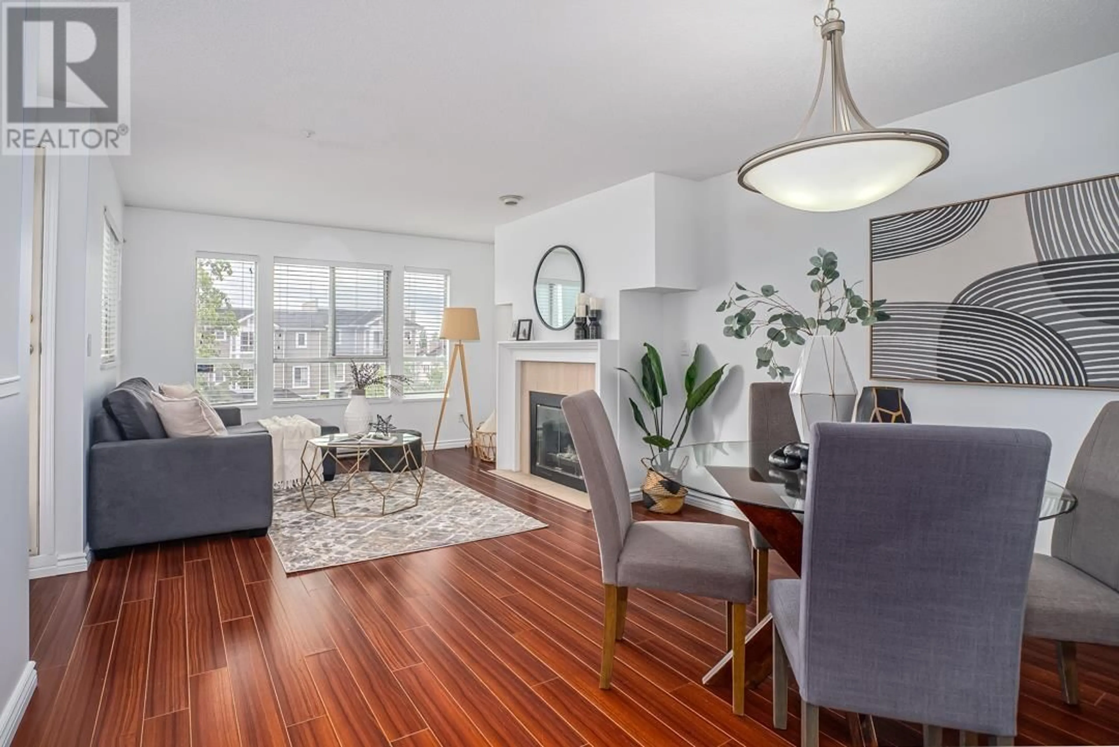 Living room with furniture, wood/laminate floor for 18 - 2658 MORNINGSTAR CRESCENT, Vancouver British Columbia V5S4P4