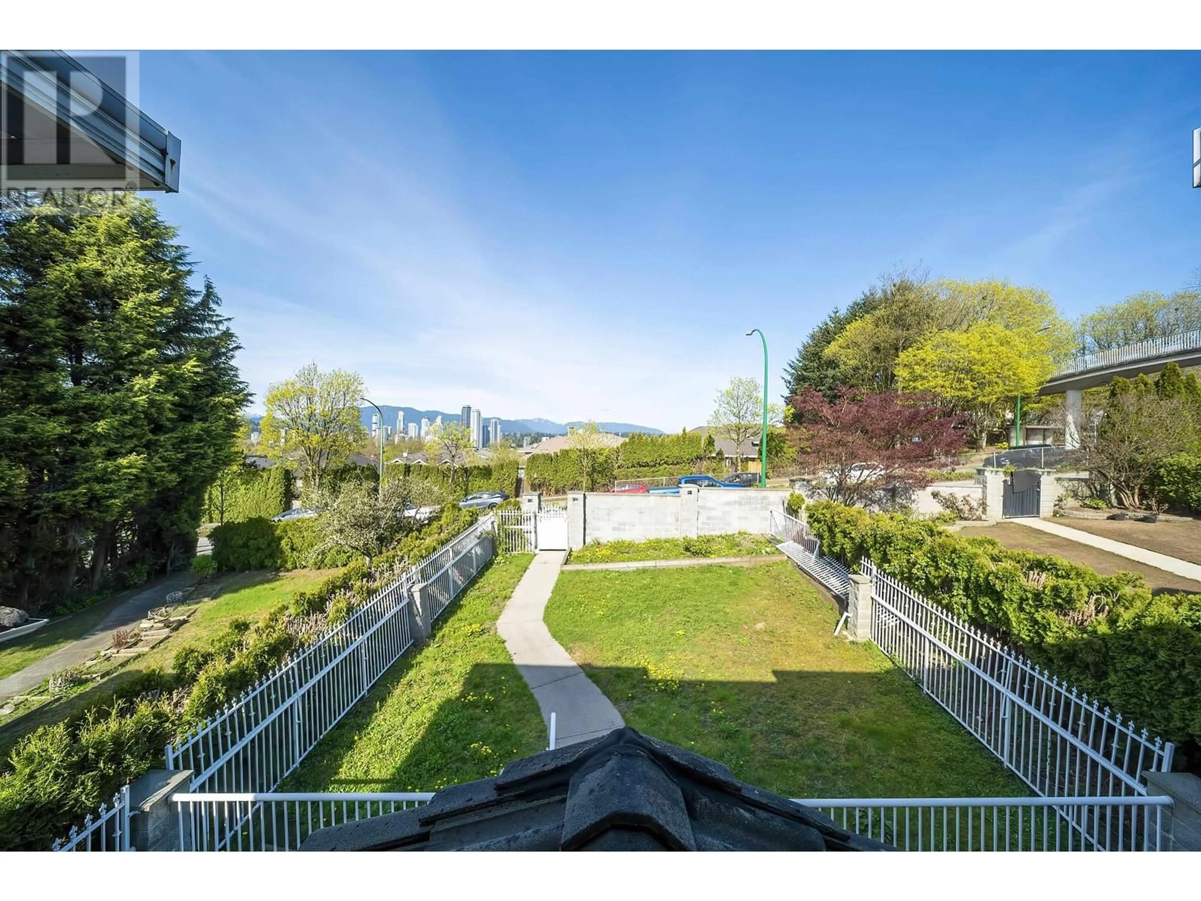 A pic from outside/outdoor area/front of a property/back of a property/a pic from drone, city buildings view from balcony for 7563 CARIBOO ROAD, Burnaby British Columbia V3N4X2
