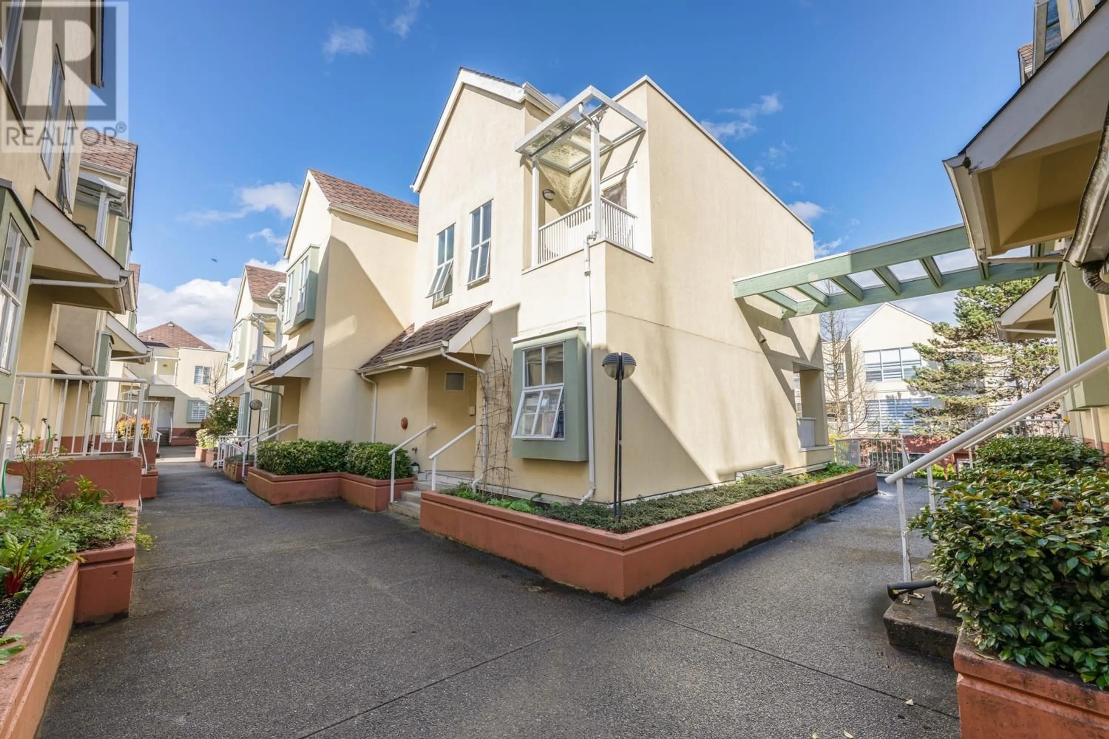 A pic from outside/outdoor area/front of a property/back of a property/a pic from drone, street for 302 - 8300 GENERAL CURRIE ROAD, Richmond British Columbia V6Y3X1