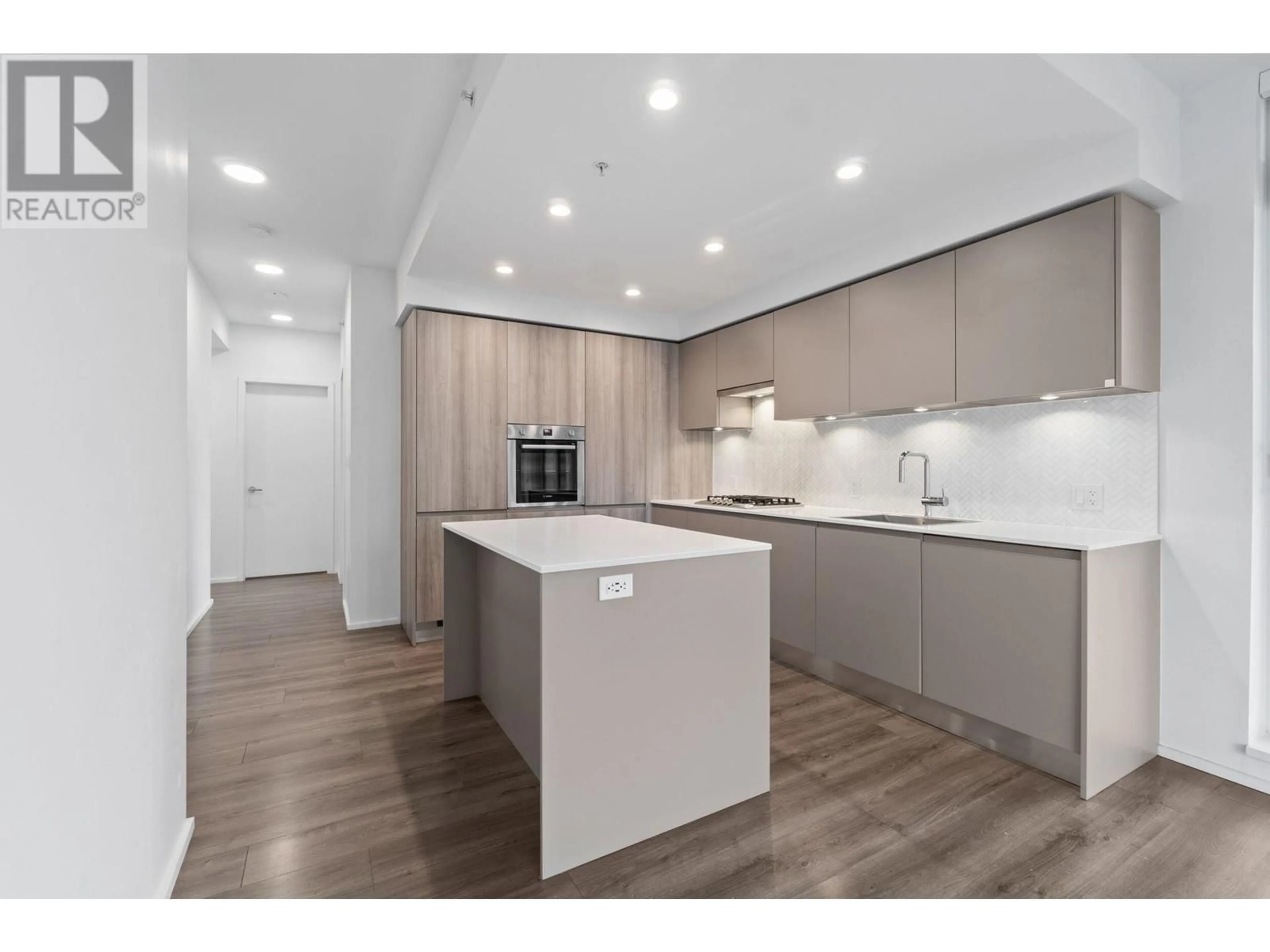 Open concept kitchen, wood/laminate floor for 1910 - 3809 EVERGREEN PLACE, Burnaby British Columbia V3J0M1