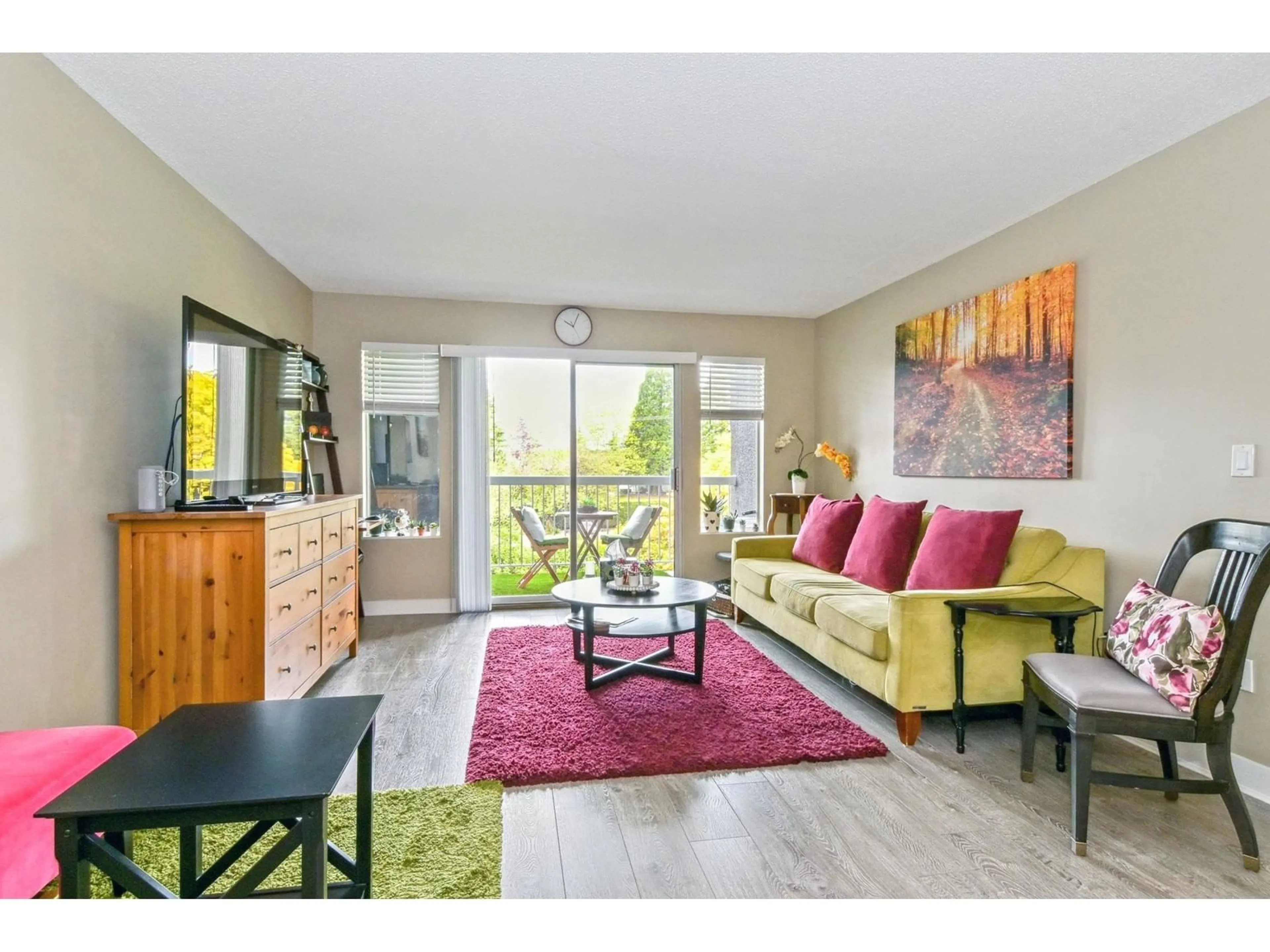 Living room with furniture, wood/laminate floor for 208 - 5700 200, Langley British Columbia V3A7S6