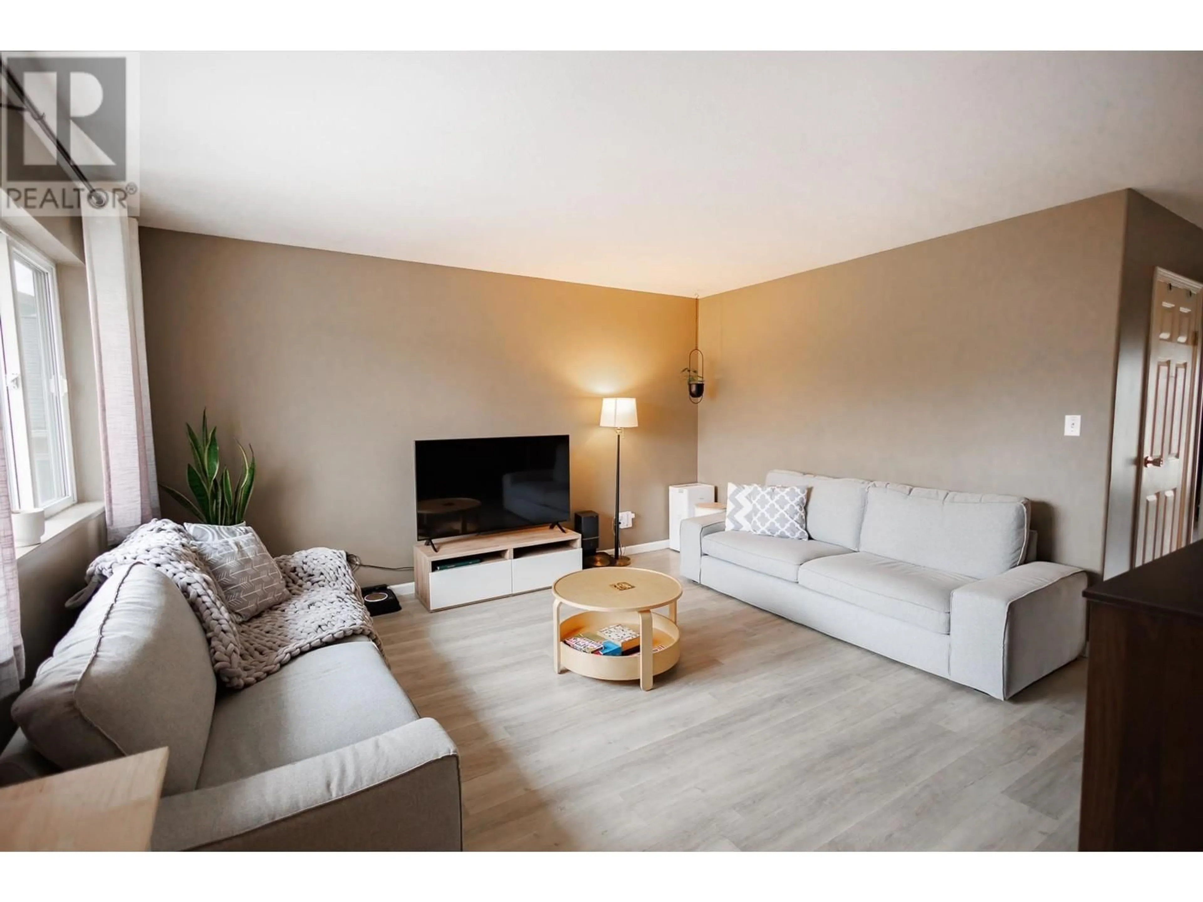 Living room with furniture, wood/laminate floor for 3 - 4737 WALSH AVENUE, Terrace British Columbia V8G1Y7