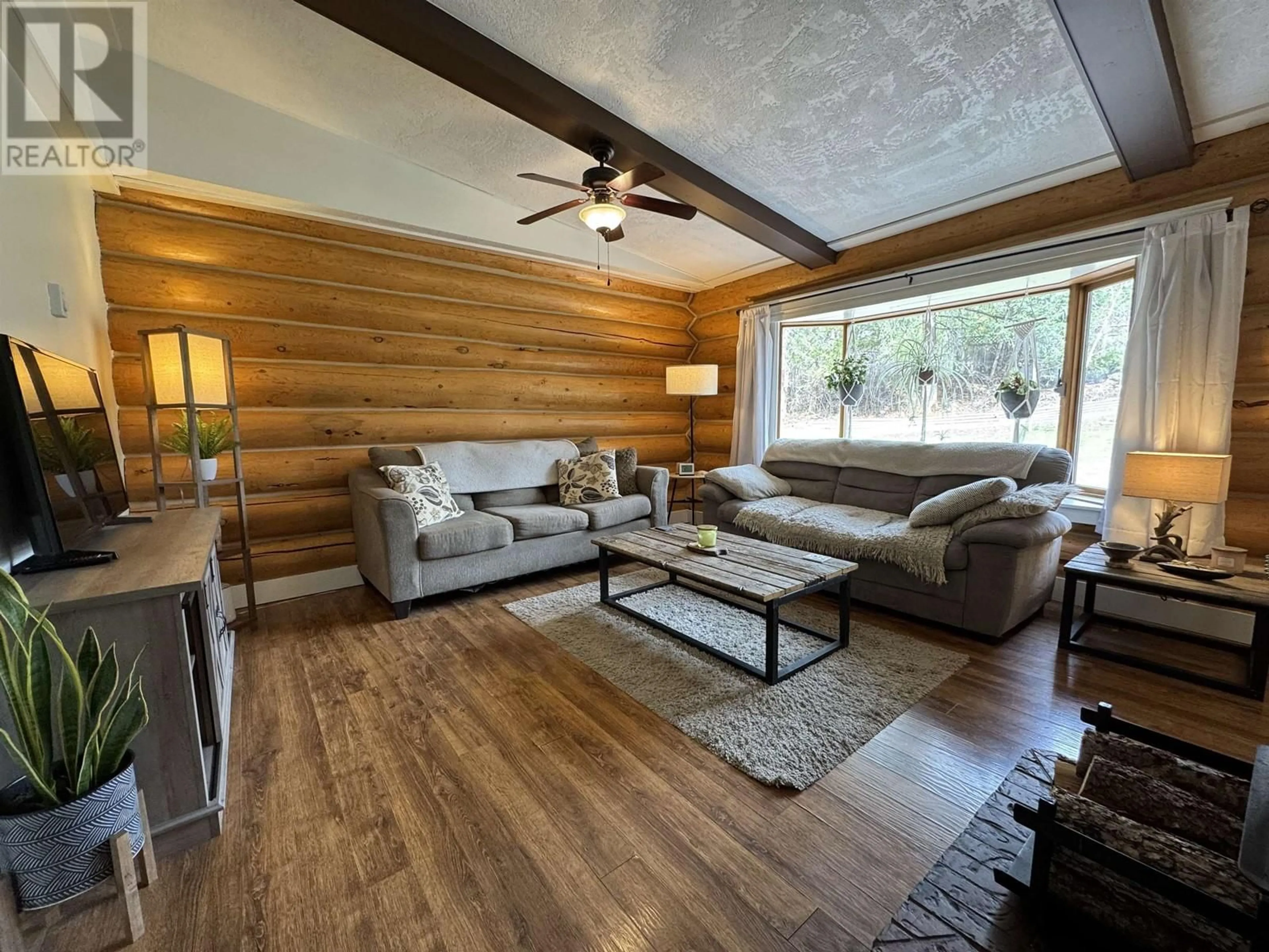 Living room with furniture, wood/laminate floor for 905 CENTAUR DRIVE, Williams Lake British Columbia V2G4G1