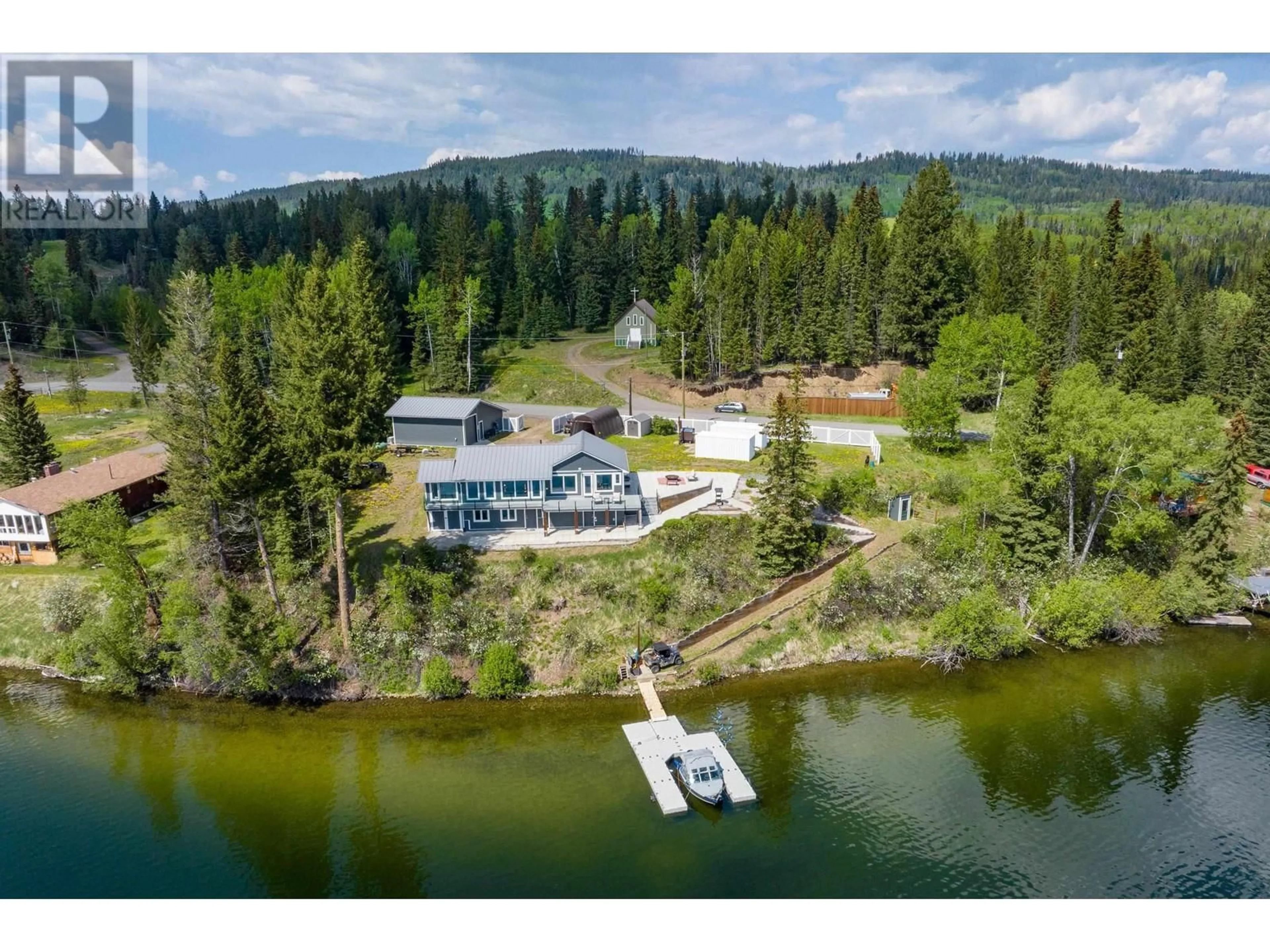 A pic from outside/outdoor area/front of a property/back of a property/a pic from drone, water/lake/river/ocean view for 8046 BRIDGE LAKE ROAD, Bridge Lake British Columbia V0K1X2