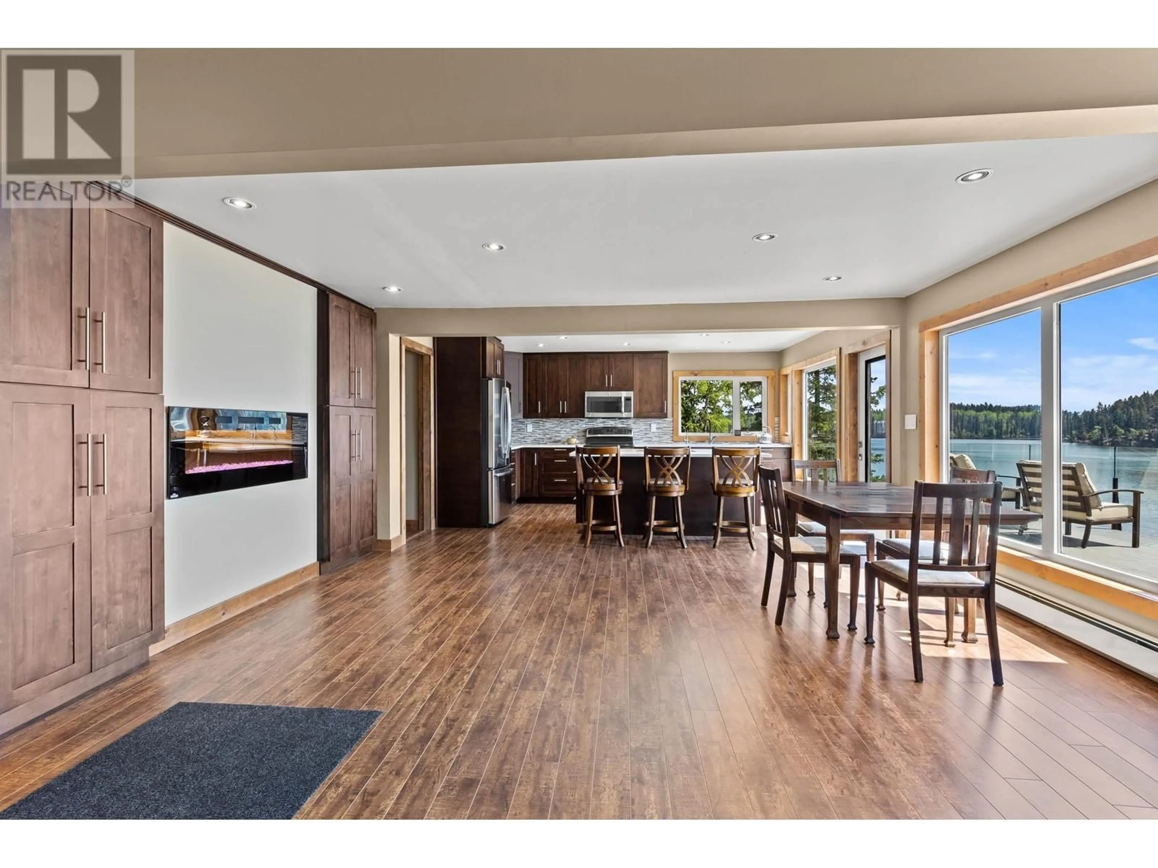 Open concept kitchen, wood/laminate floor for 8046 BRIDGE LAKE ROAD, Bridge Lake British Columbia V0K1X2