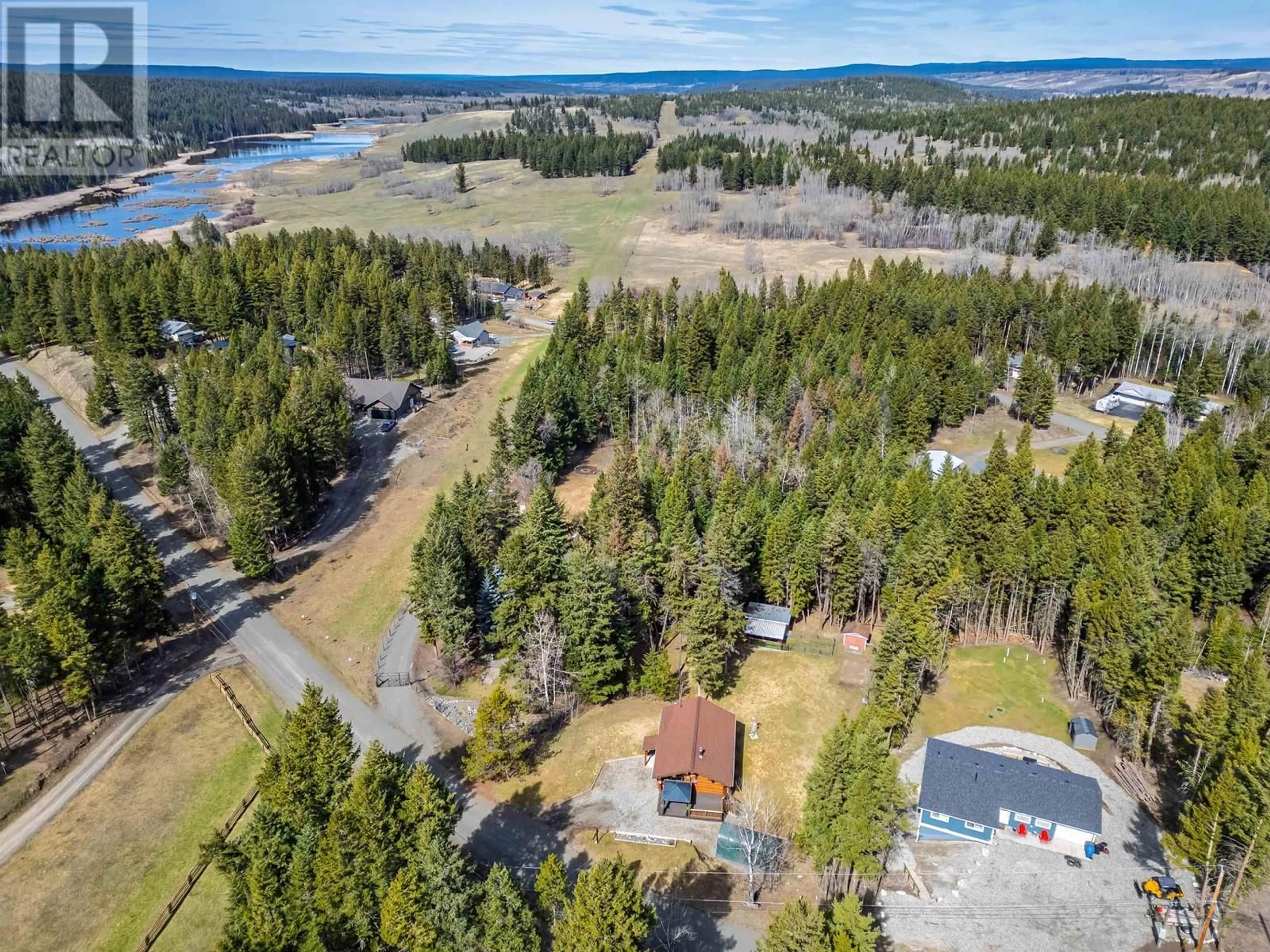 A pic from outside/outdoor area/front of a property/back of a property/a pic from drone, forest/trees view for 5231 DAVIS ROAD, 108 Mile Ranch British Columbia V0K2Z0