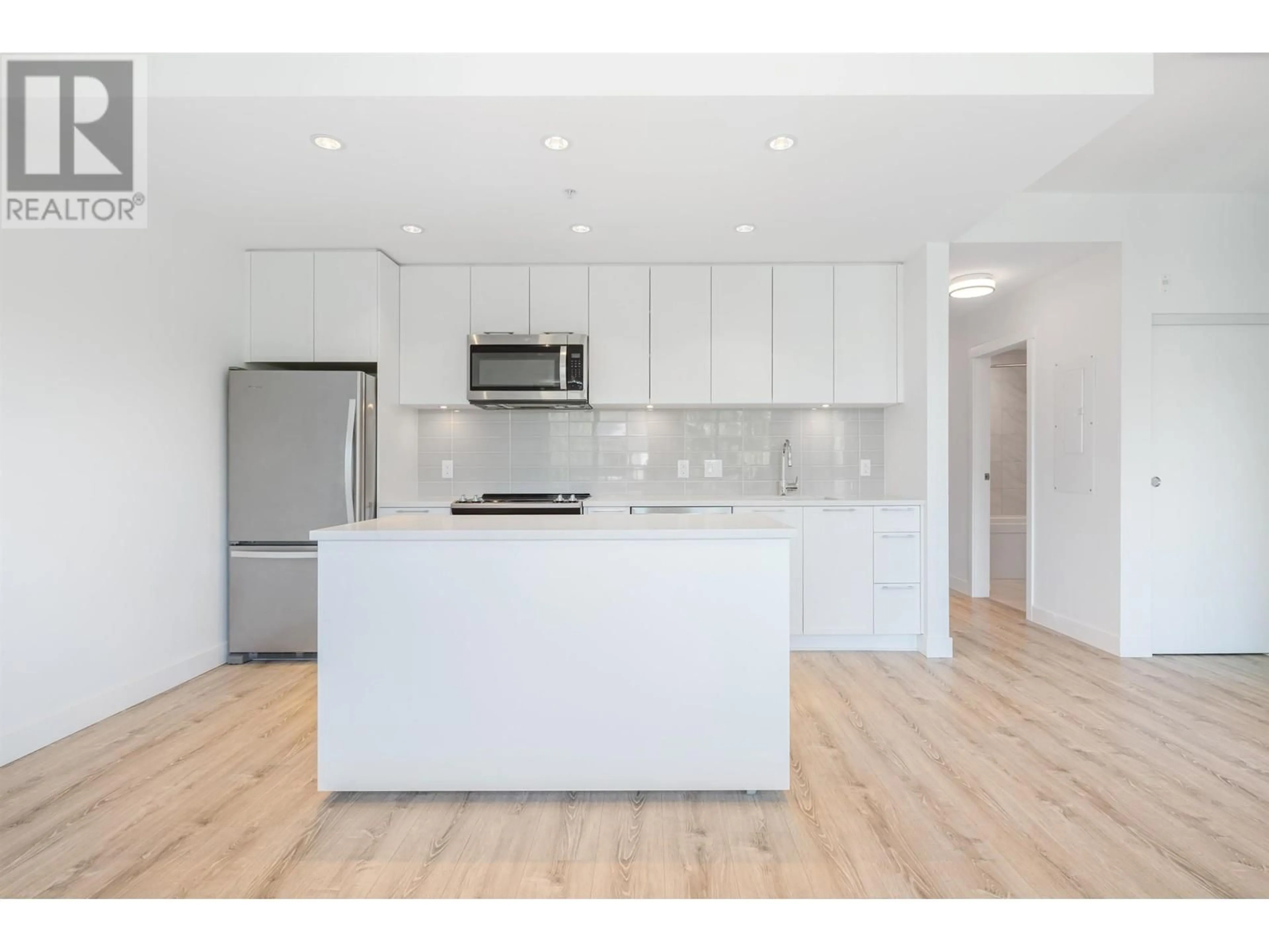 Open concept kitchen, wood/laminate floor for 407 - 2382 ATKINS AVENUE, Port Coquitlam British Columbia V3C0G7