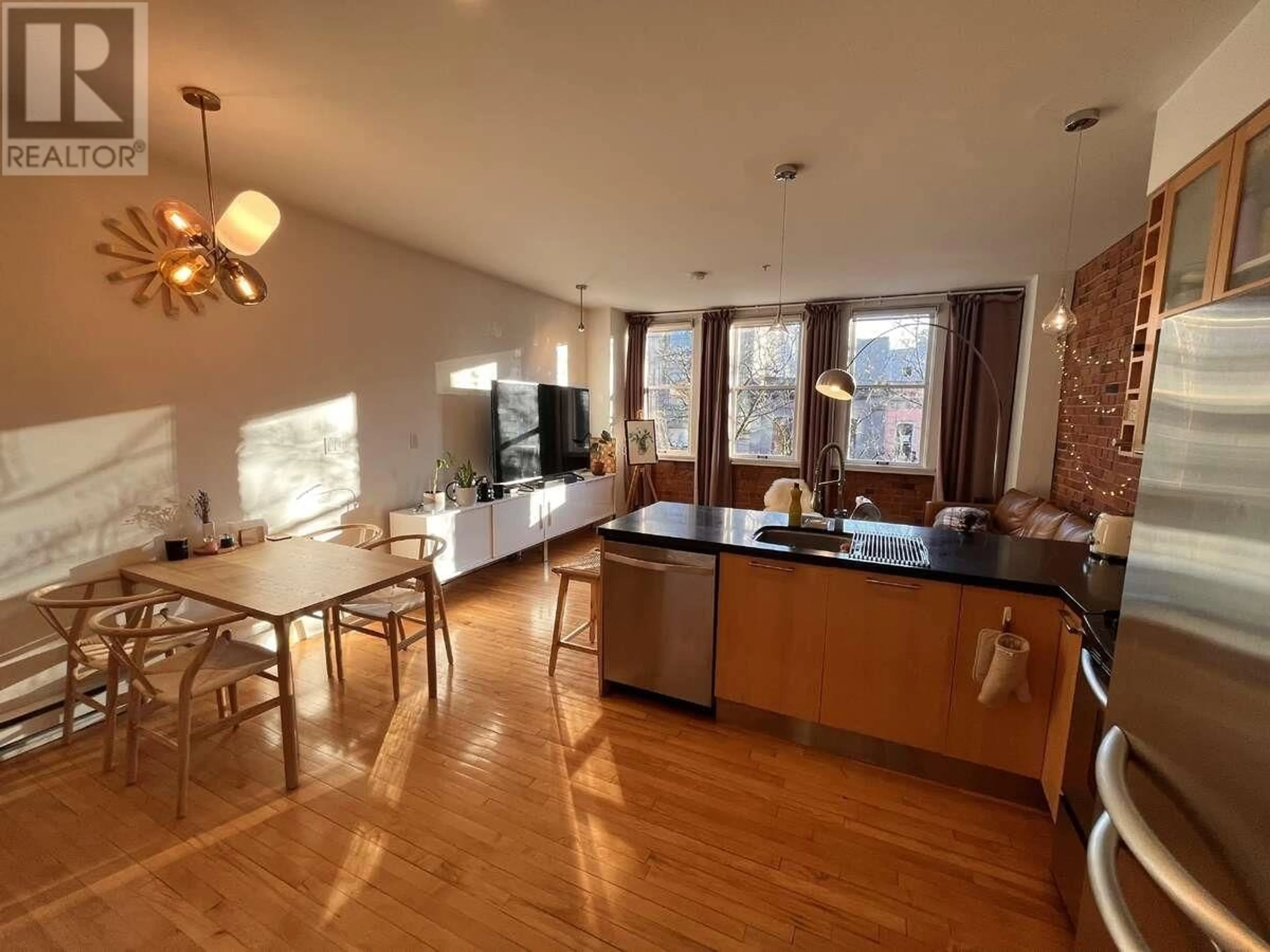 Open concept kitchen, wood/laminate floor for 403 - 345 WATER STREET, Vancouver British Columbia V6B1B8