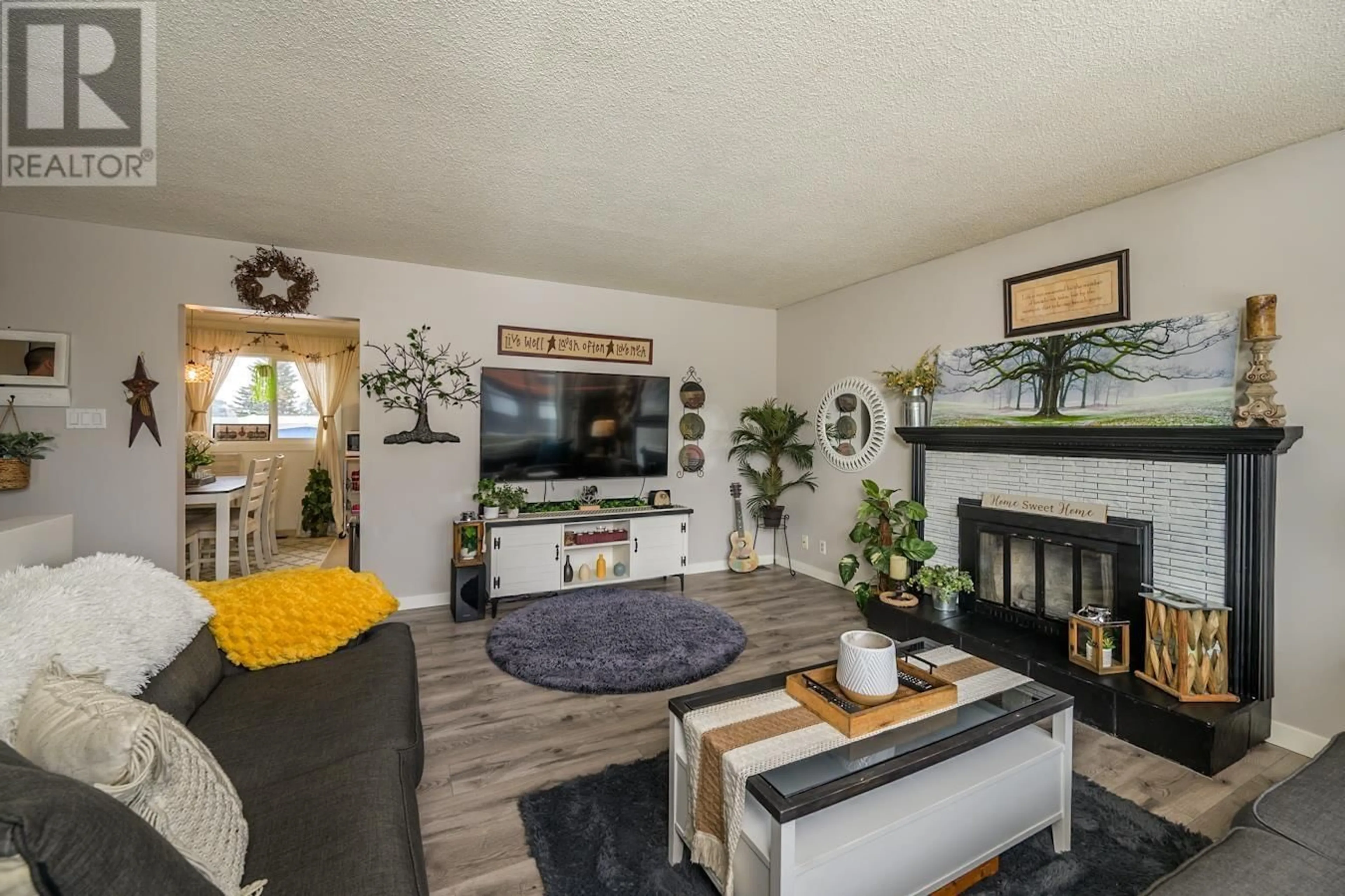 Living room with furniture, wood/laminate floor for 154 QUINN STREET, Prince George British Columbia V2M3J4