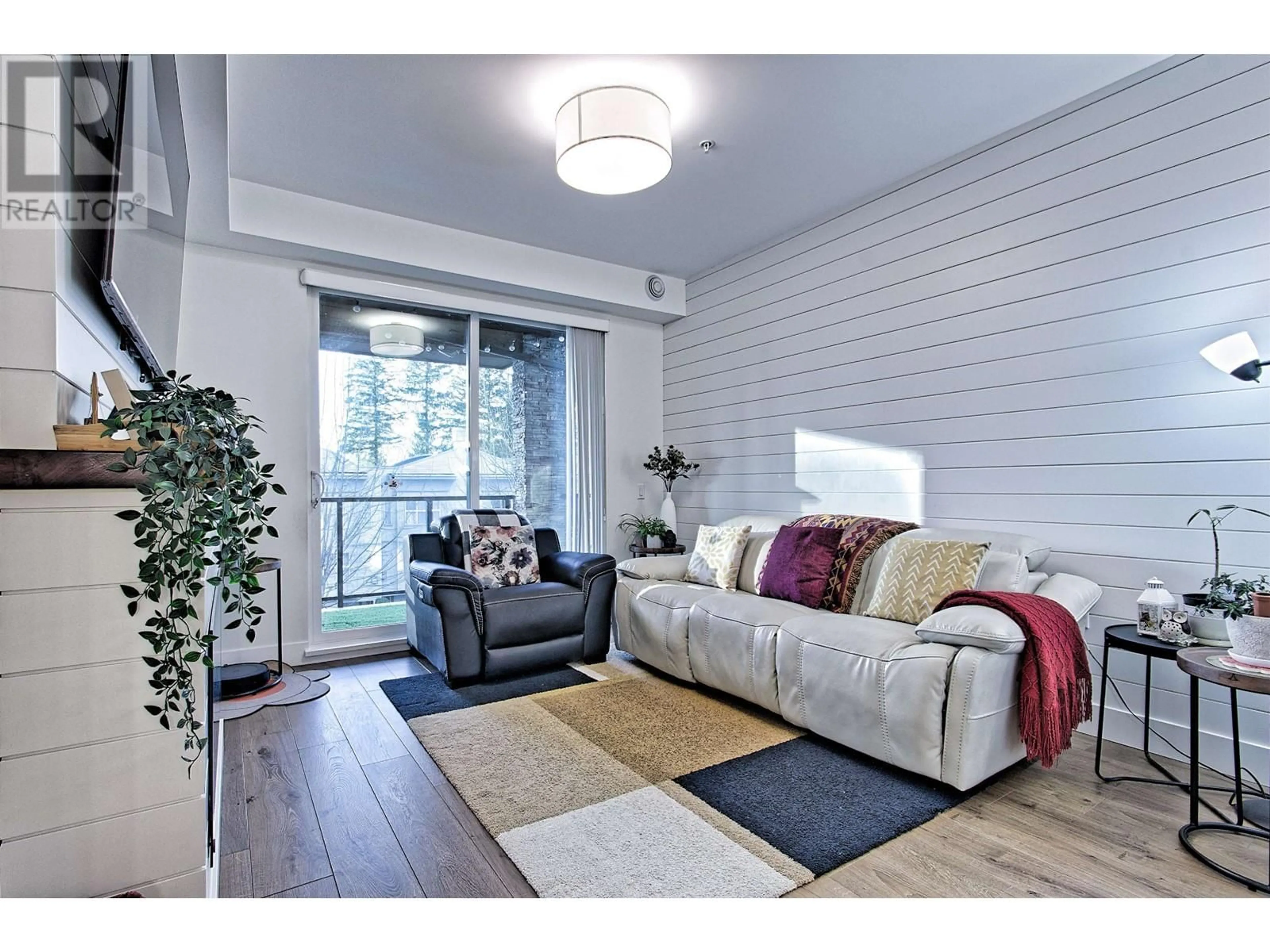 Living room with furniture, wood/laminate floor for 303 - 12460 191 STREET, Pitt Meadows British Columbia V3Y2J2