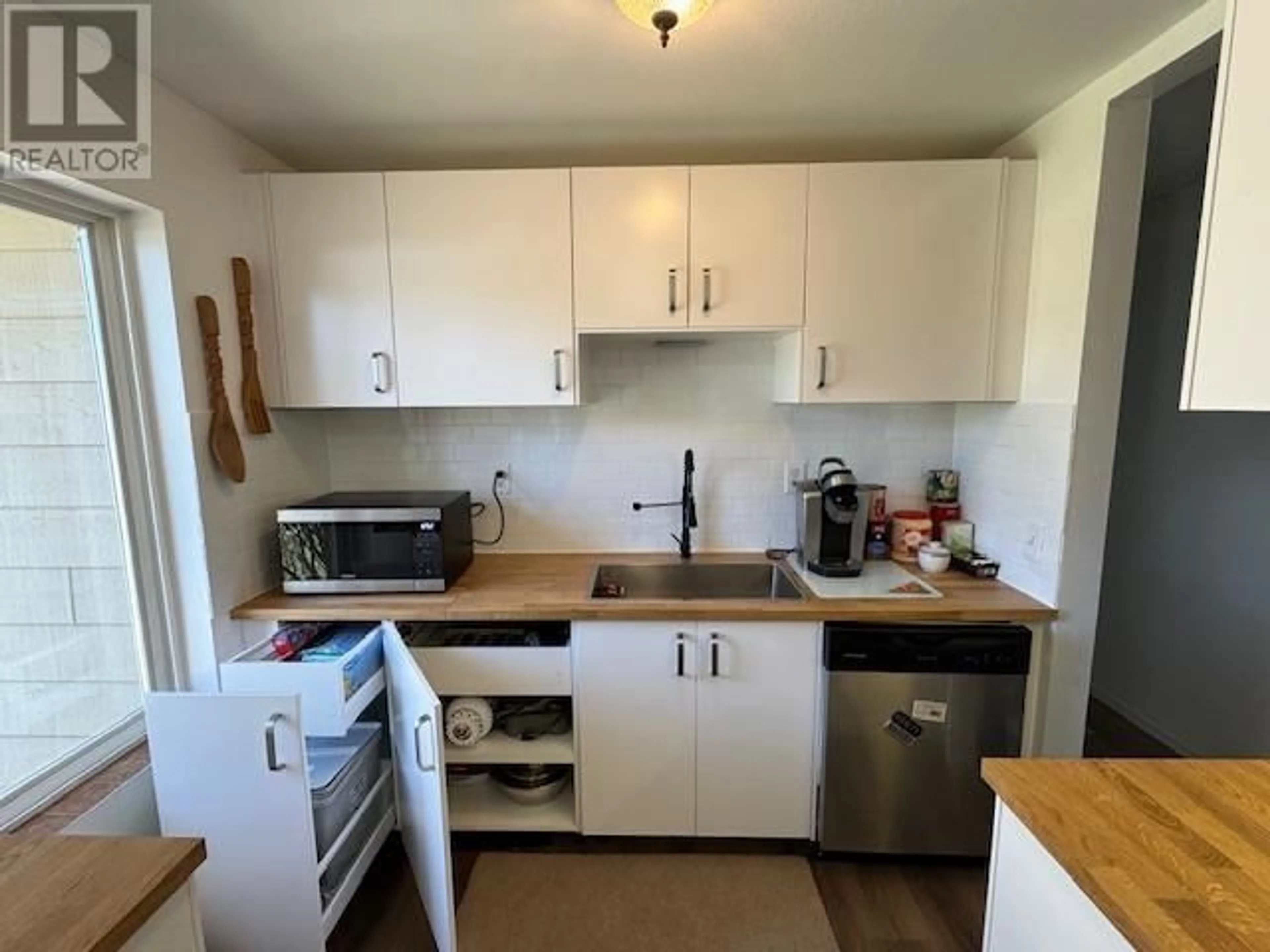 Standard kitchen, wood/laminate floor for 7673 GRAHAM ROAD, Bridge Lake British Columbia V0K1E0