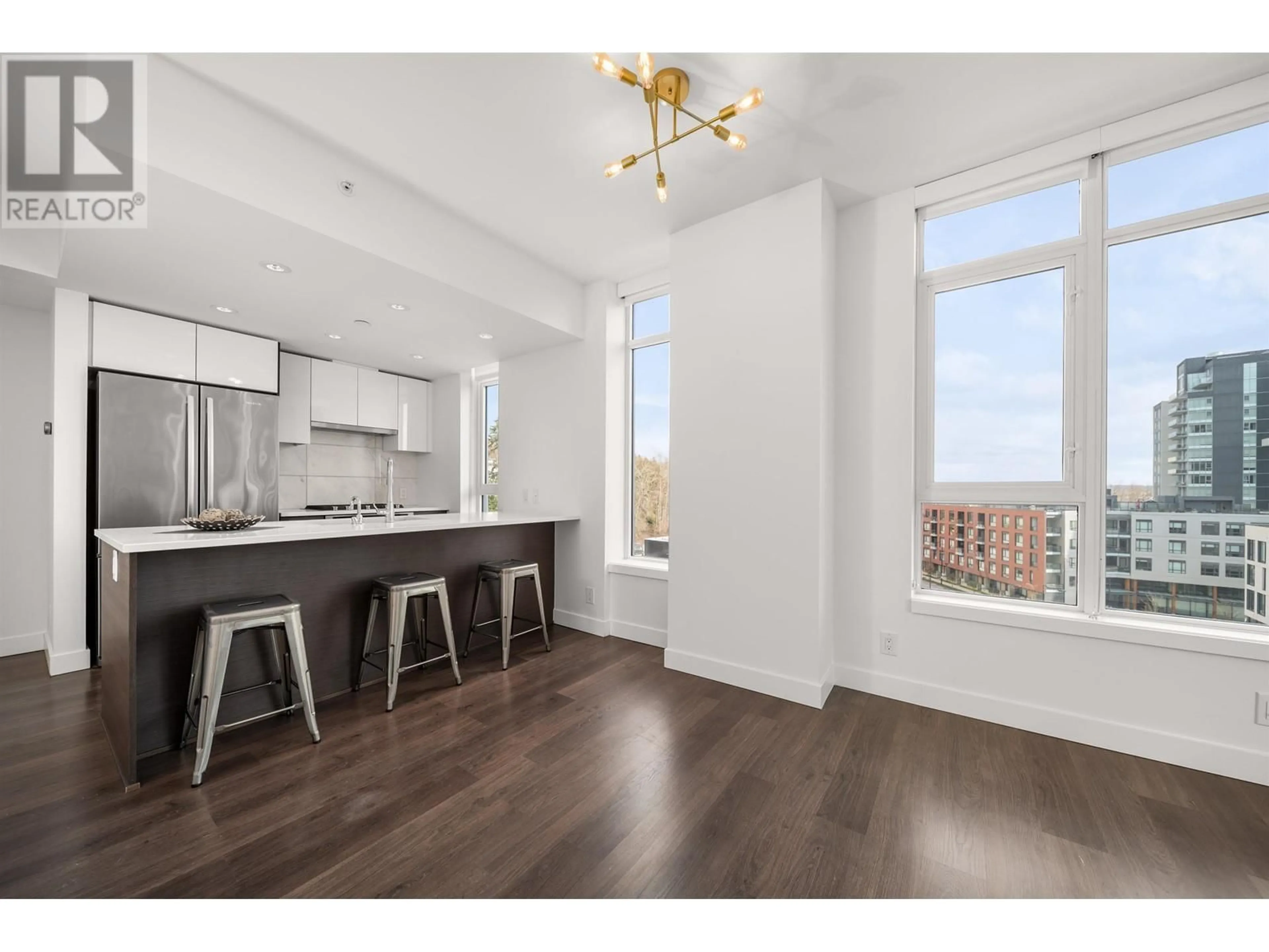 Open concept kitchen, wood/laminate floor for 718 - 3557 SAWMILL CRESCENT, Vancouver British Columbia V5S0E2
