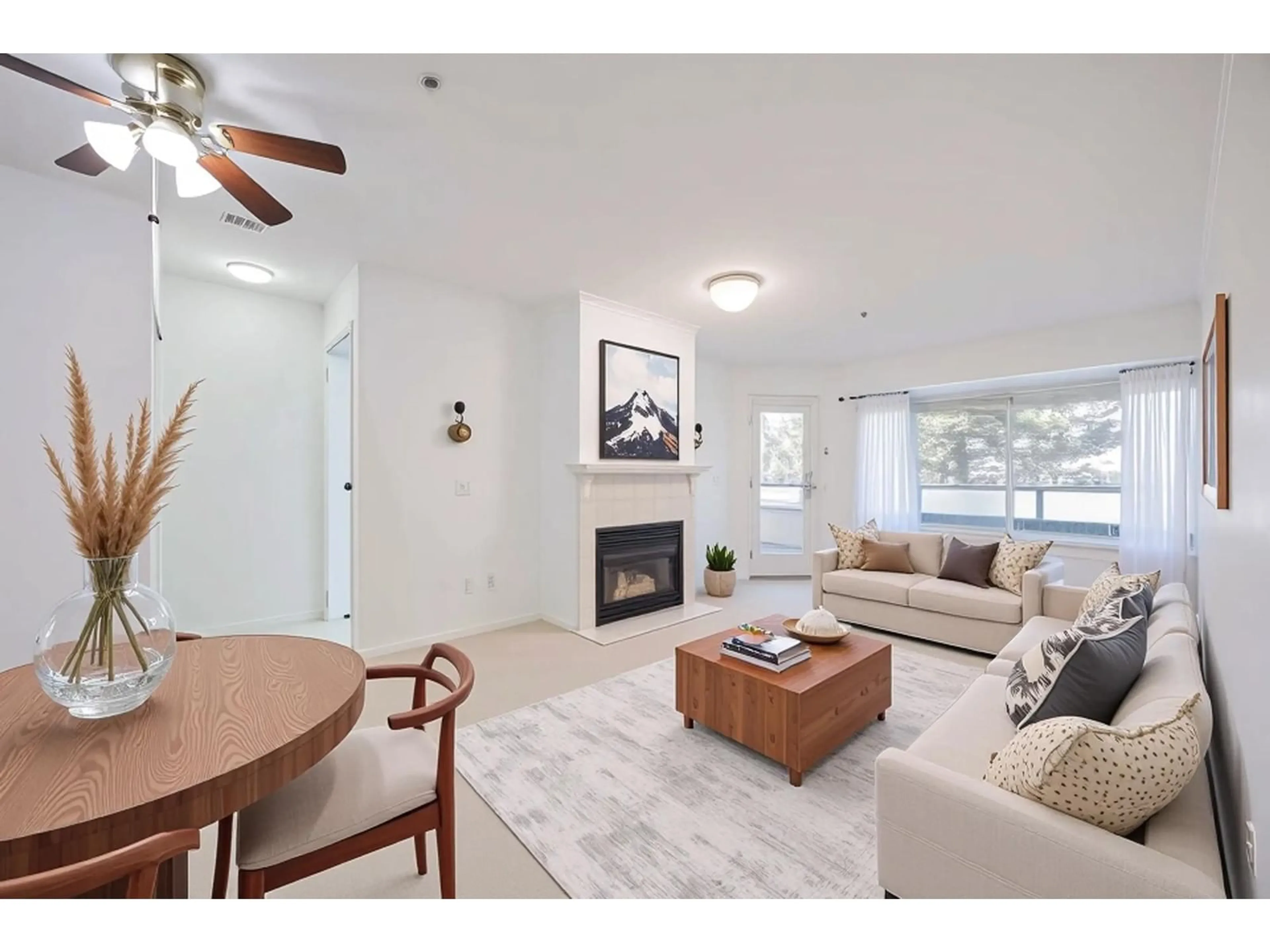 Living room with furniture, wood/laminate floor for 206 - 2962 TRETHEWEY, Abbotsford British Columbia V2T4M3