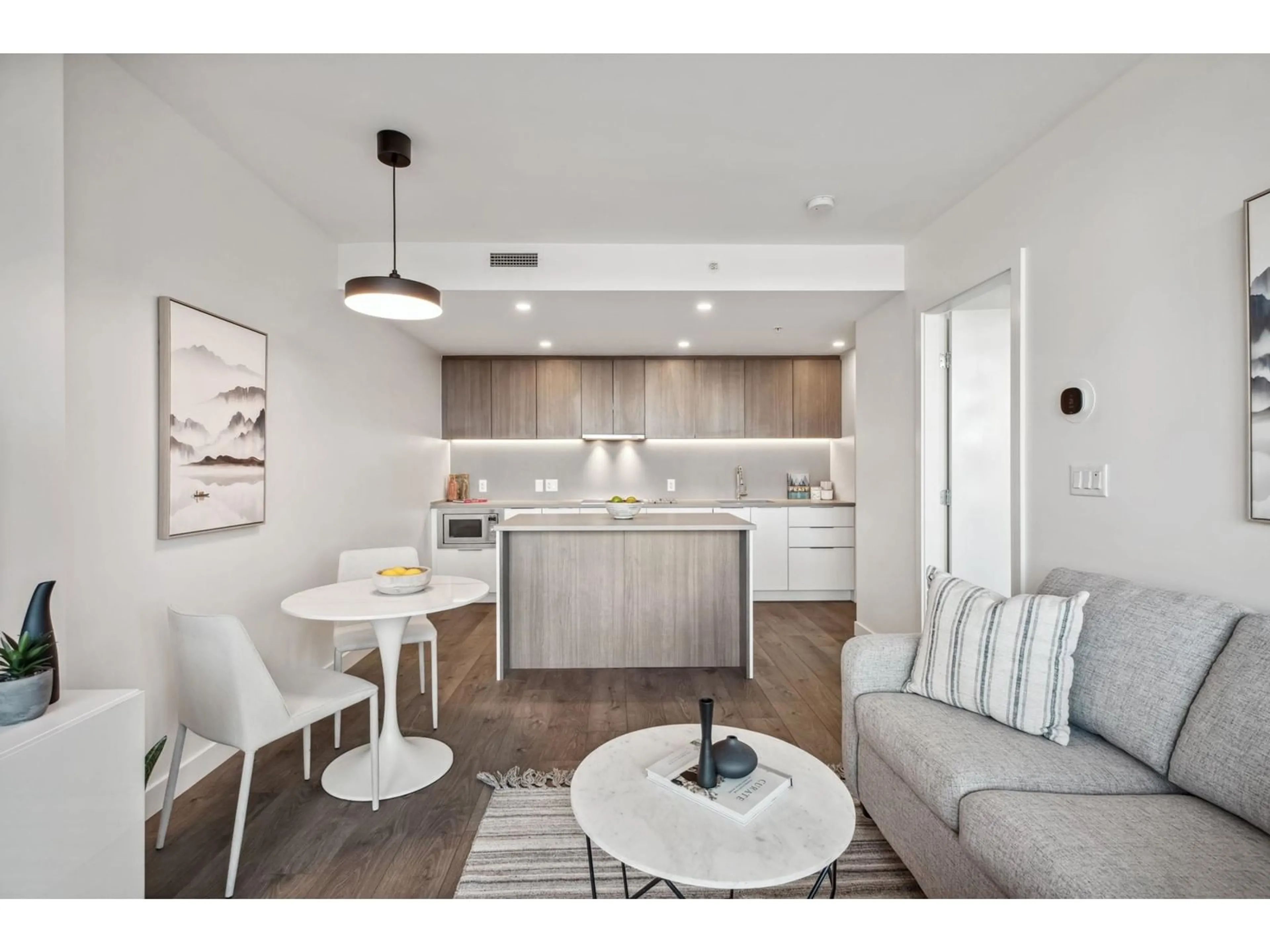 Open concept kitchen, wood/laminate floor for 609 - 13318 104, Surrey British Columbia V3T0R2