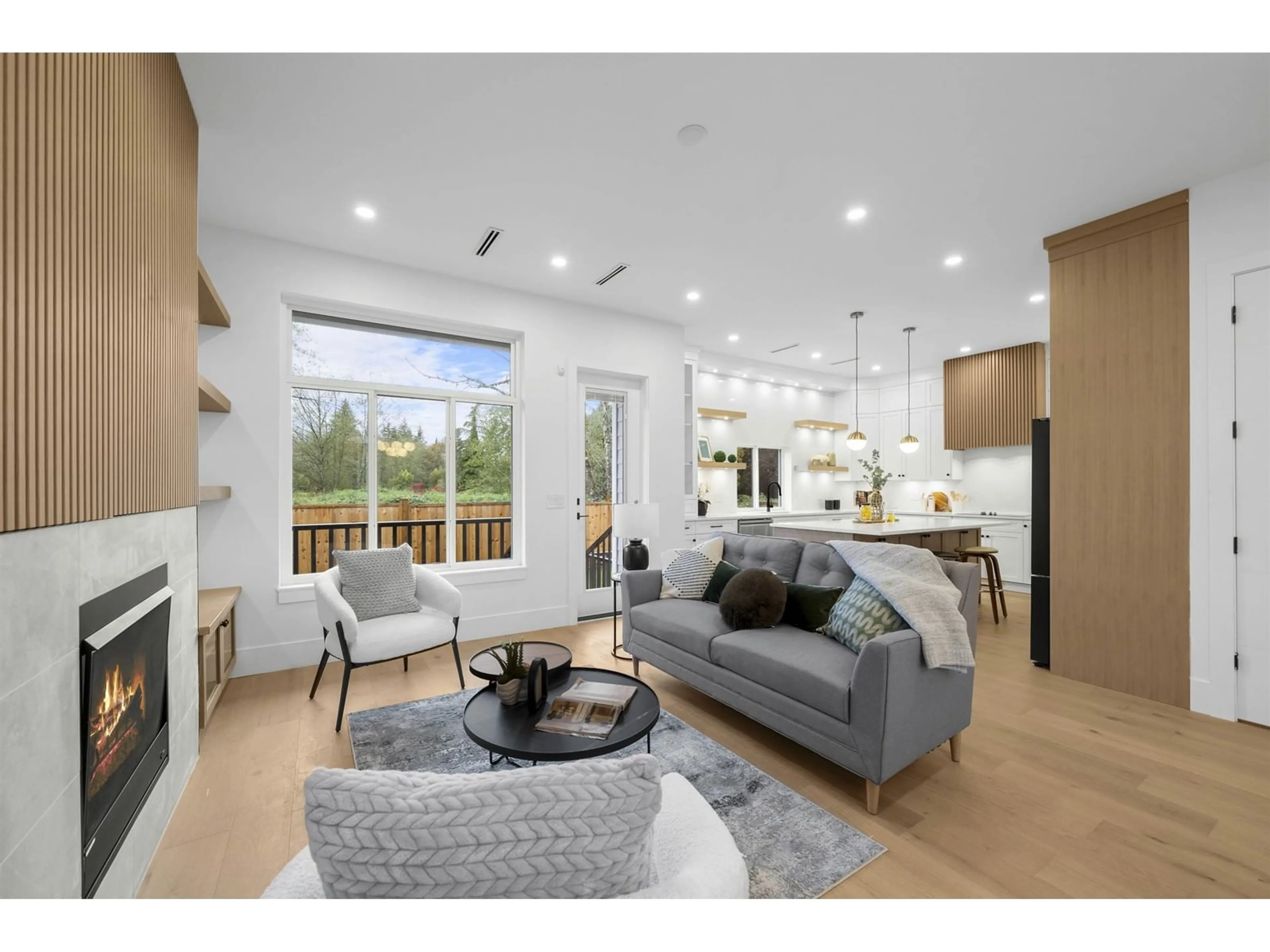 Living room with furniture, wood/laminate floor for 7523 205, Langley British Columbia V2Y3S8
