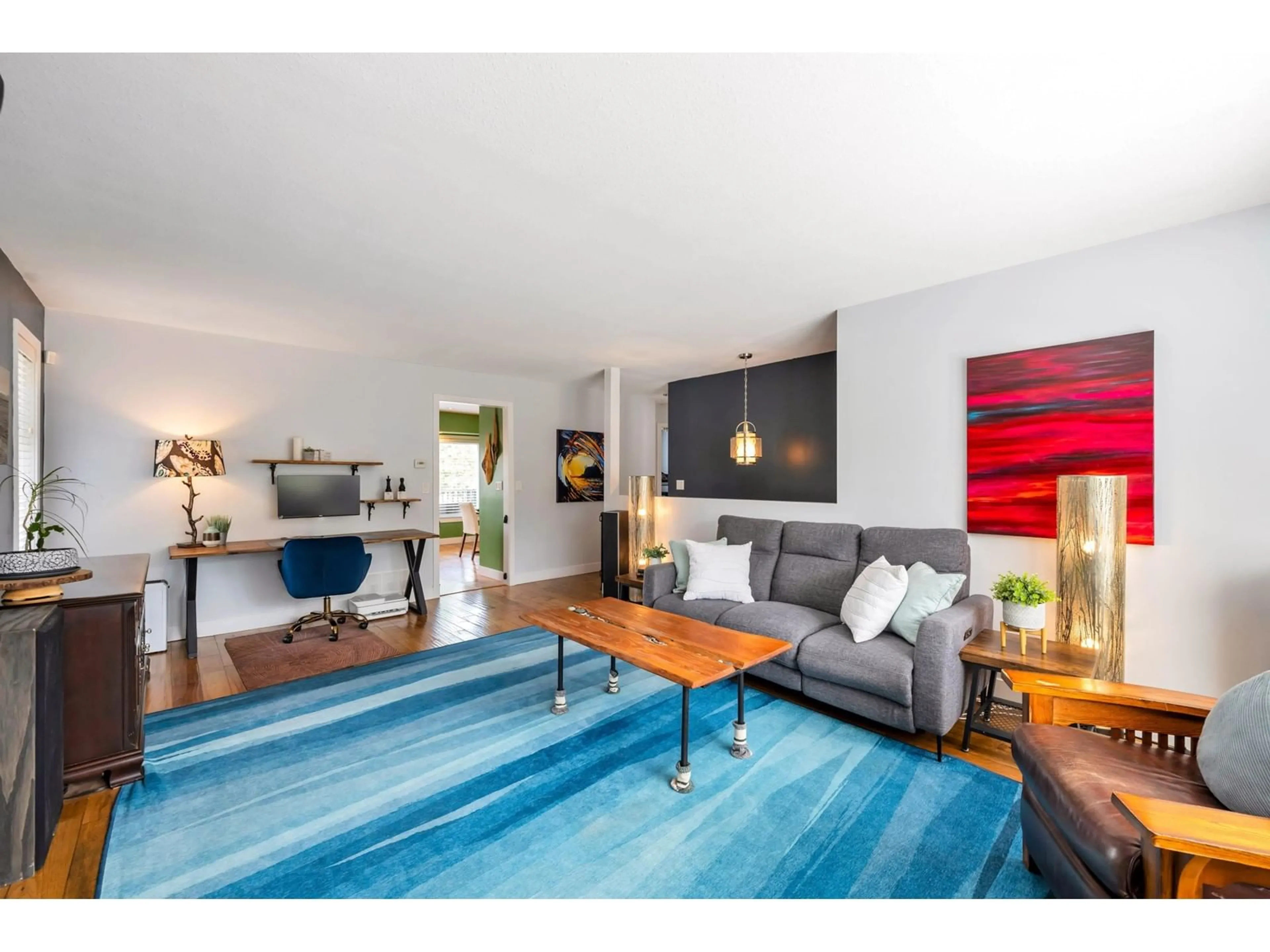 Living room with furniture, wood/laminate floor for 19823 48, Langley British Columbia V3A3L2