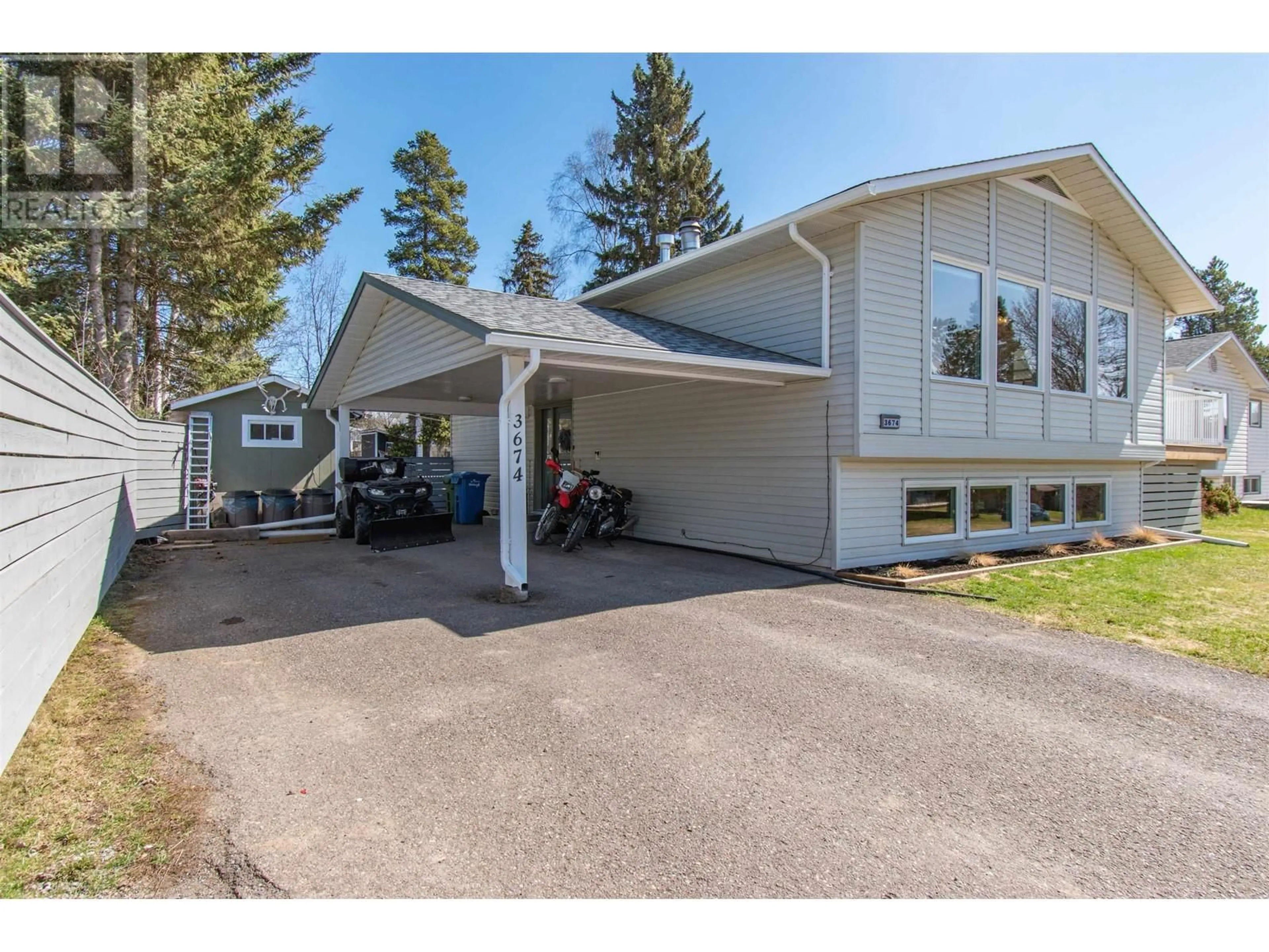 Home with vinyl exterior material, street for 3674 16TH AVENUE, Smithers British Columbia V0J2N0