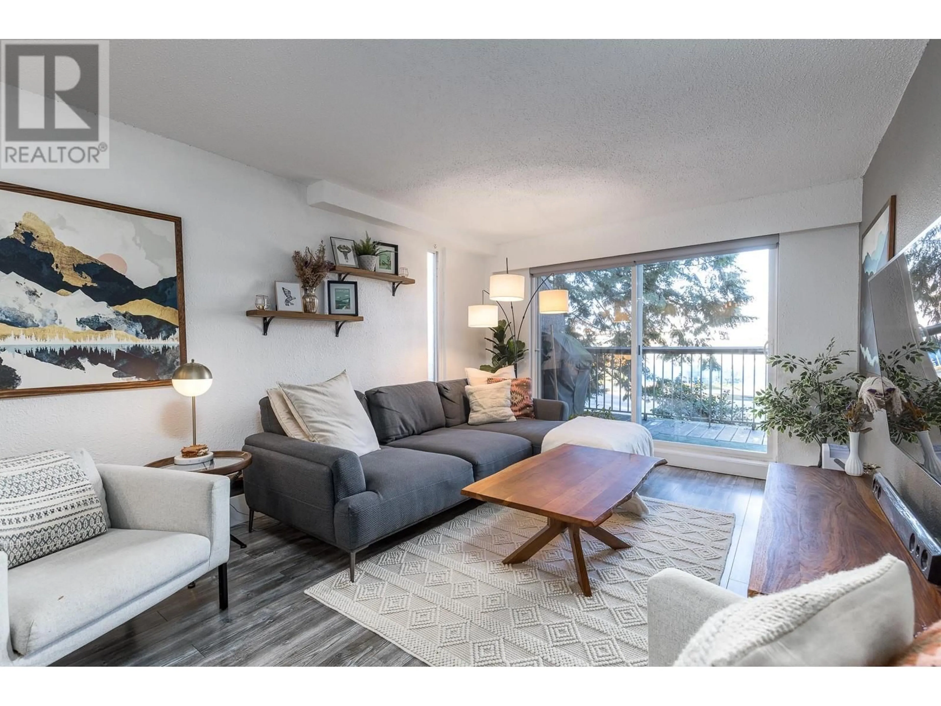 Living room with furniture, unknown for 201 - 756 GREAT NORTHERN WAY, Vancouver British Columbia V5T1E4