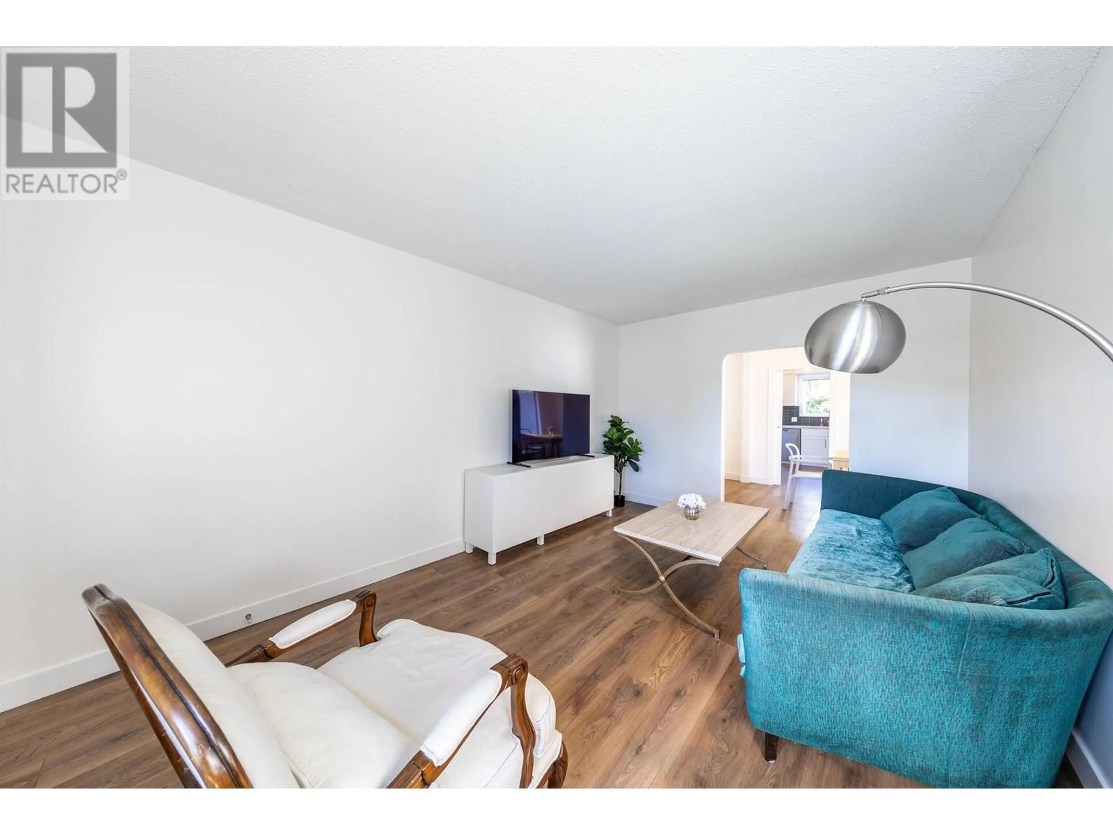 Living room with furniture, wood/laminate floor for 3405 24TH AVENUE, Vancouver British Columbia V6S1L3