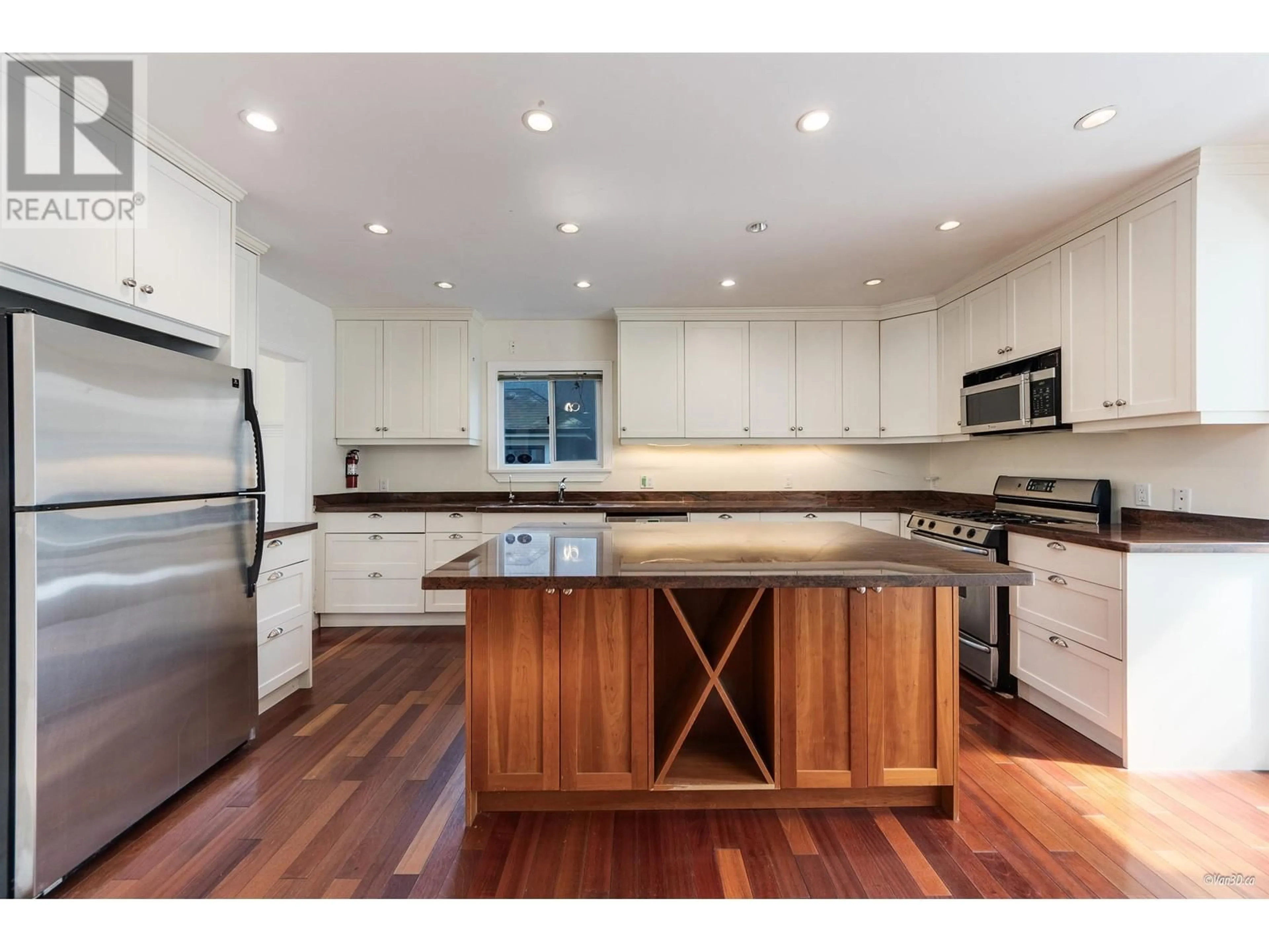 Open concept kitchen, wood/laminate floor for 2146 33RD AVENUE, Vancouver British Columbia V6M1B9