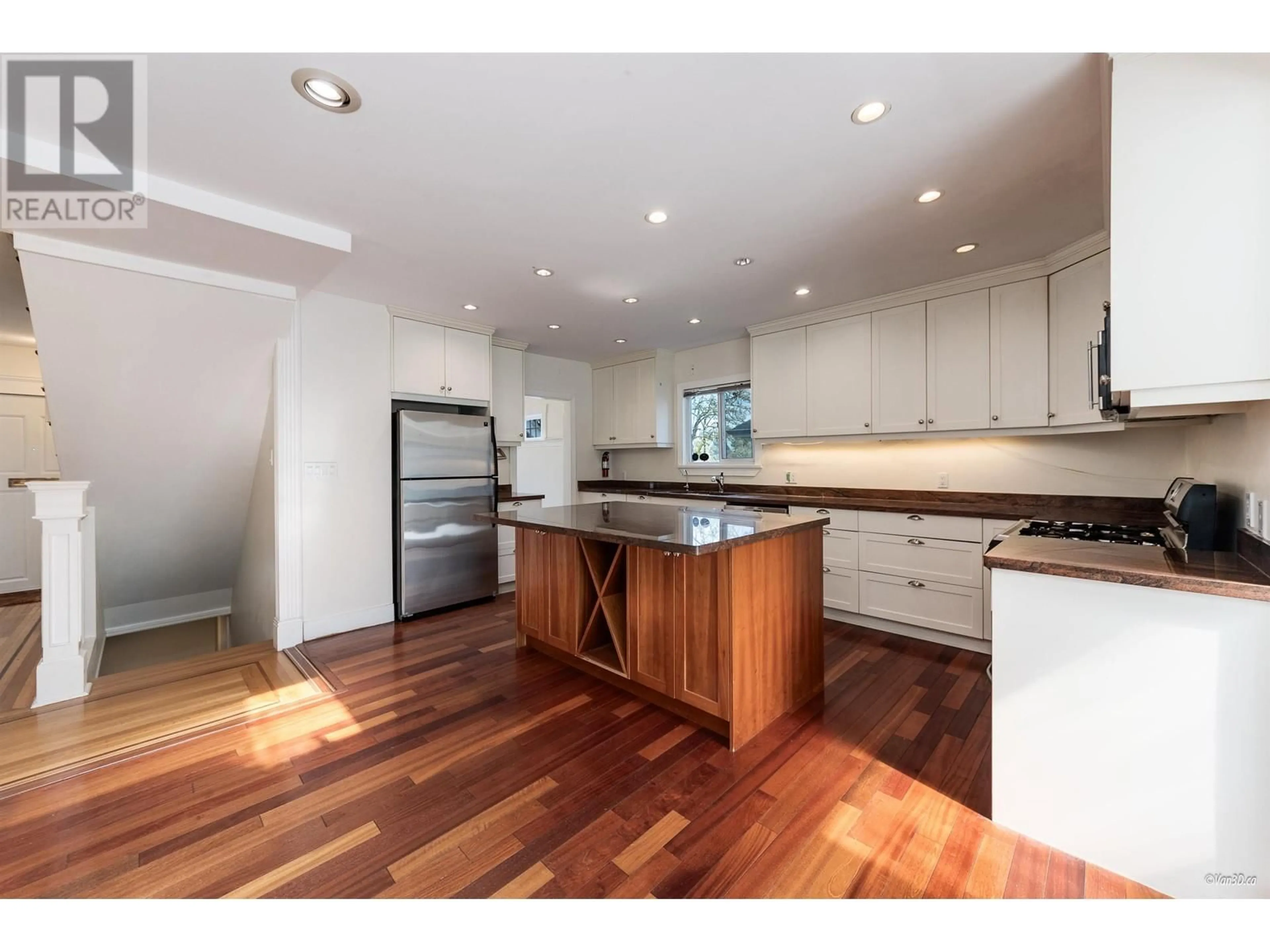 Open concept kitchen, wood/laminate floor for 2146 33RD AVENUE, Vancouver British Columbia V6M1B9