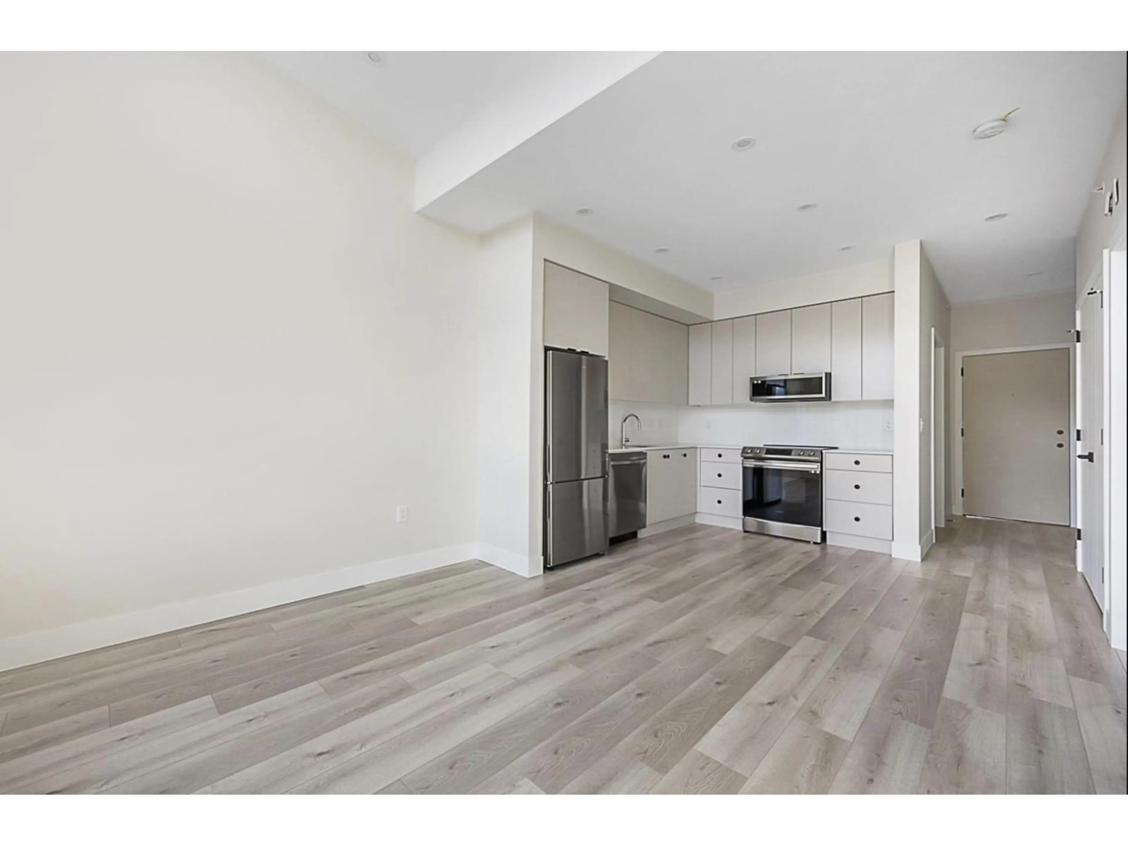 Open concept kitchen, wood/laminate floor for 401 - 45505 CAMPUS DRIVE, Chilliwack British Columbia V2R6L2