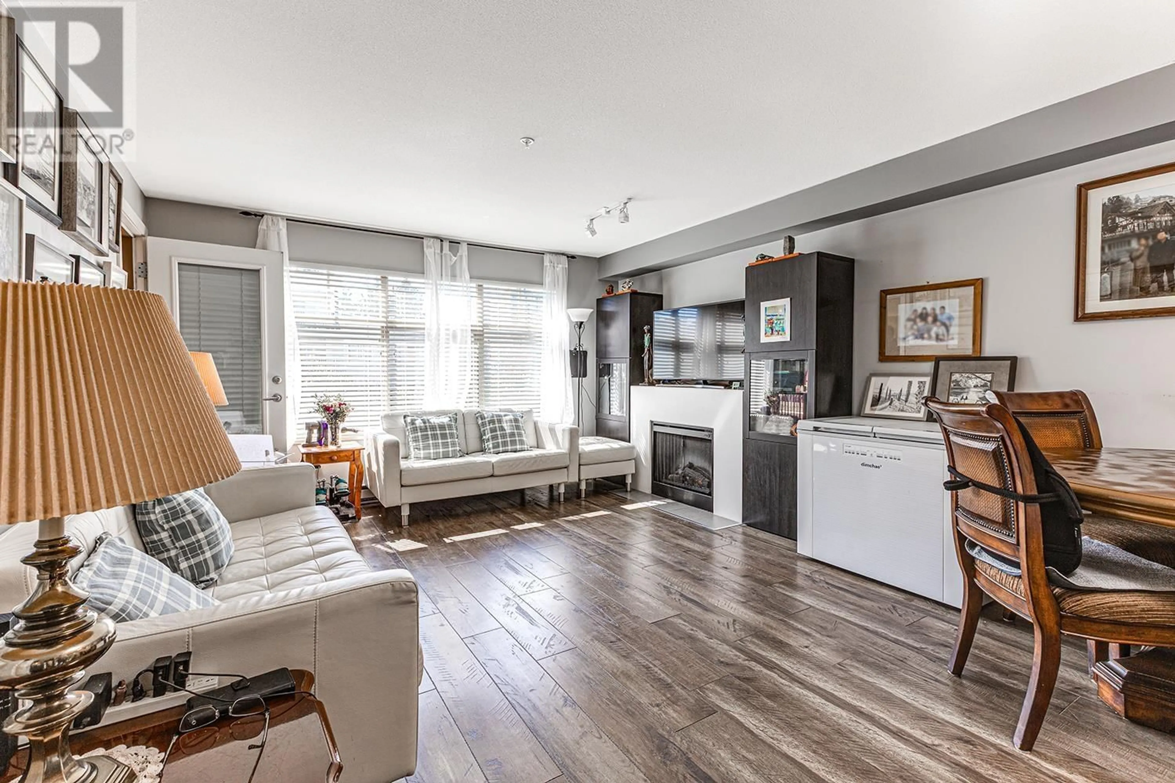 Living room with furniture, wood/laminate floor for 313 - 12238 224 STREET, Maple Ridge British Columbia V2X8W5