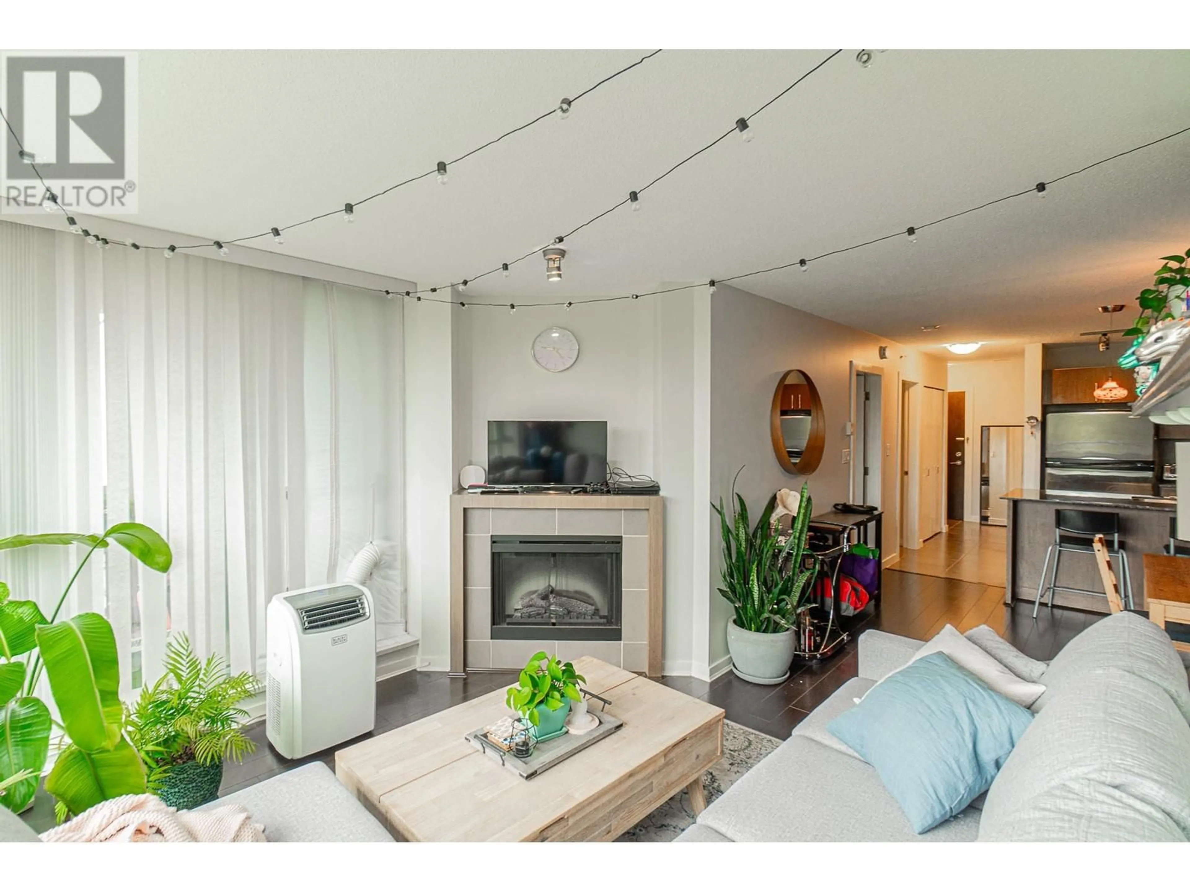 Living room with furniture, wood/laminate floor for 1205 - 4888 BRENTWOOD DRIVE, Burnaby British Columbia V5C0C6