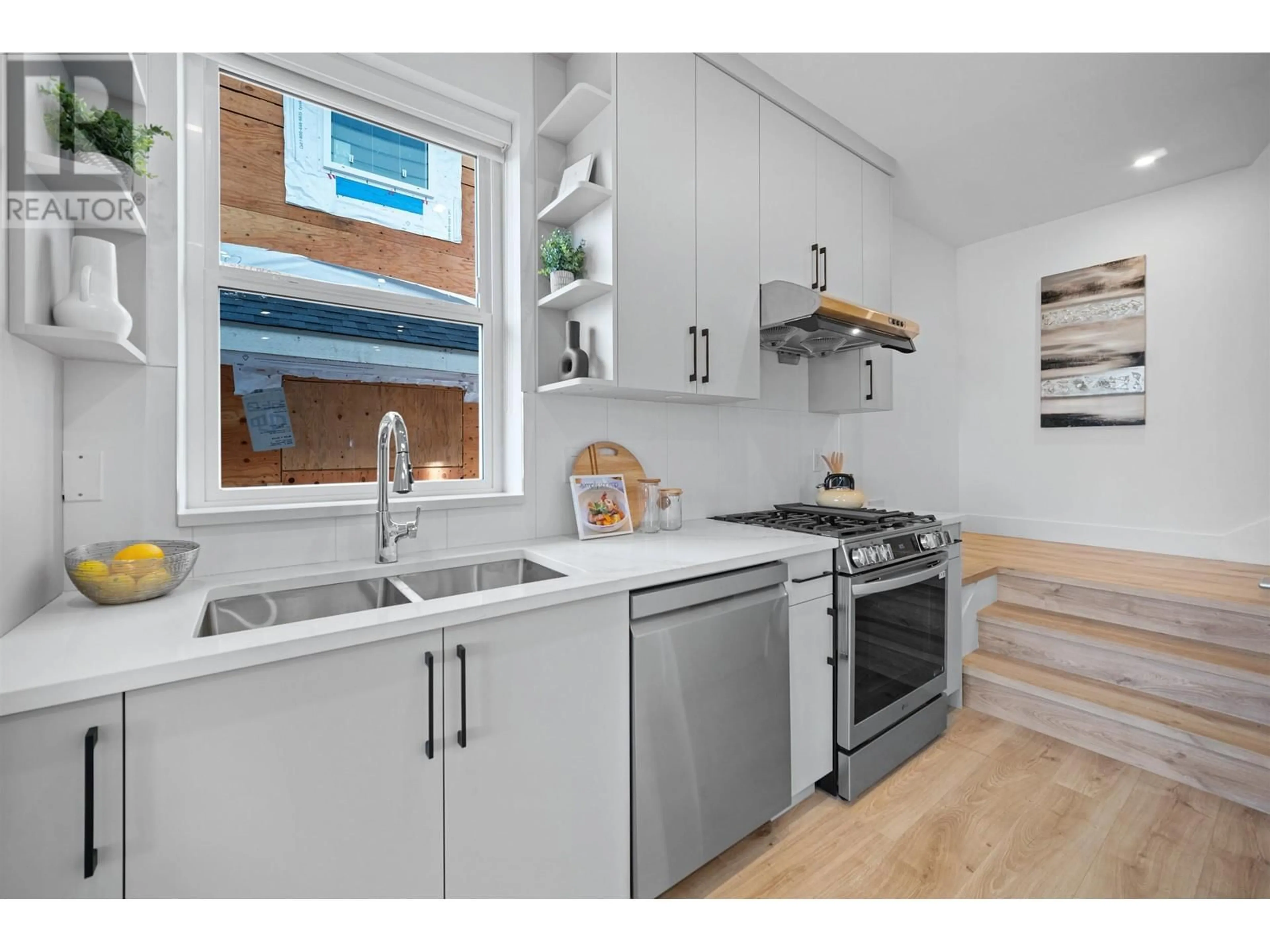 Open concept kitchen, wood/laminate floor for 1 - 3644 28TH AVENUE, Vancouver British Columbia V5R1T7