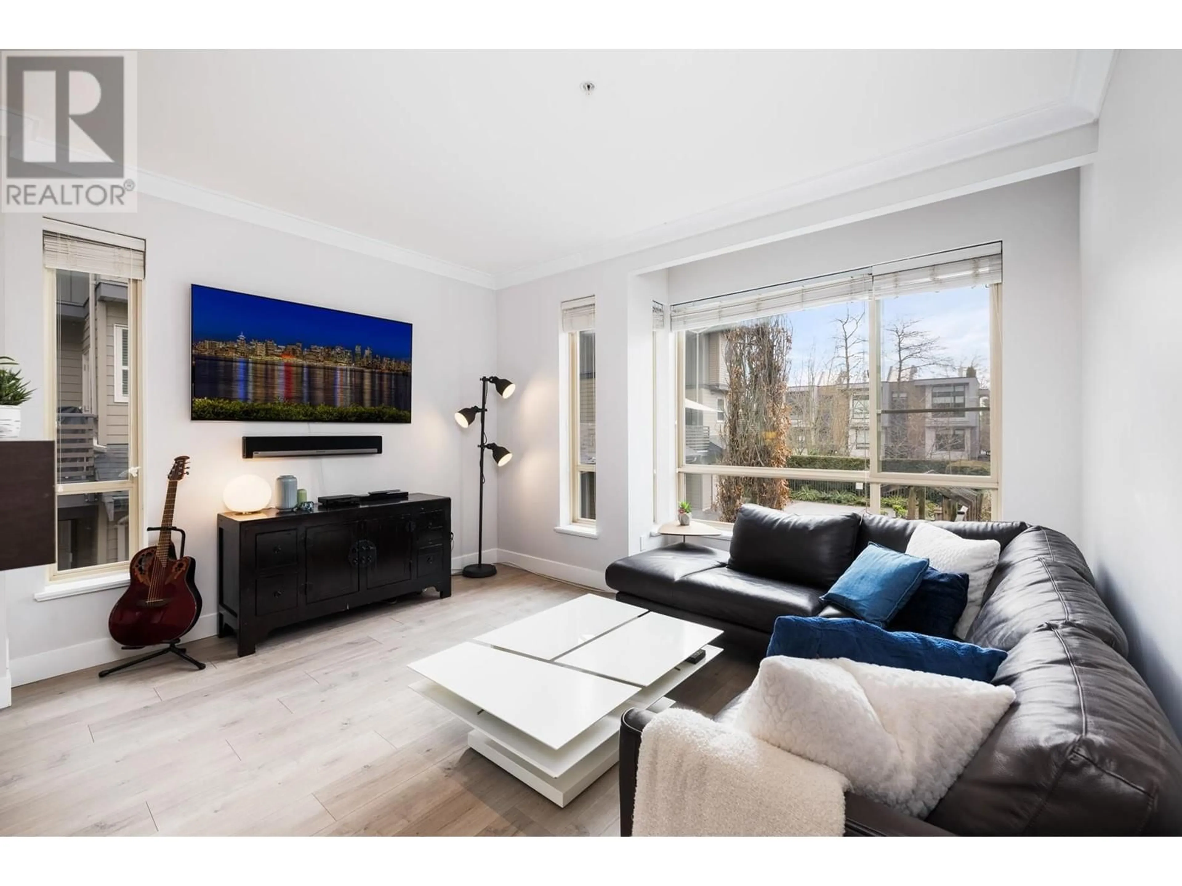 Living room with furniture, wood/laminate floor for 9 - 897 PREMIER STREET, North Vancouver British Columbia V7J2G7