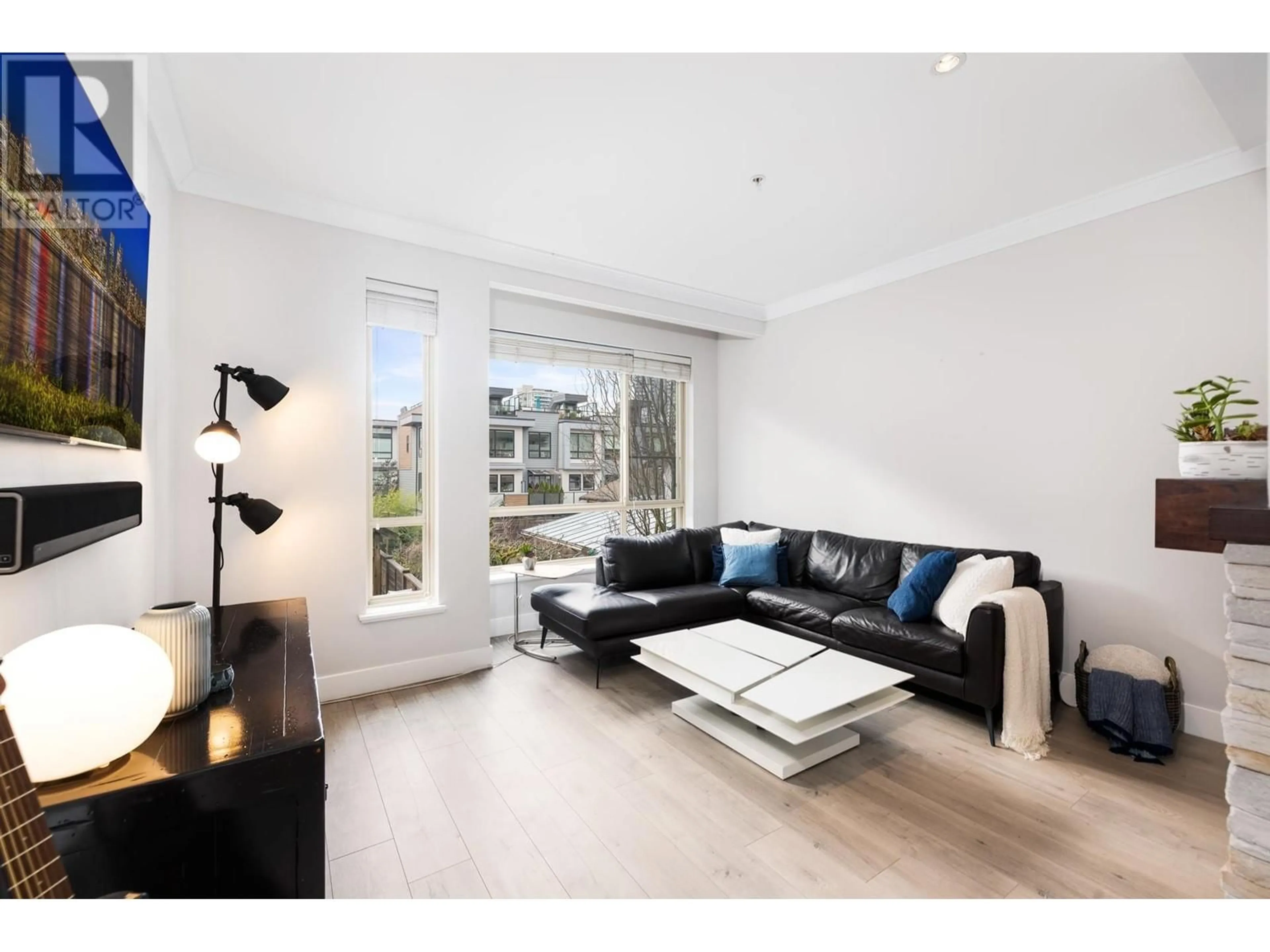 Living room with furniture, wood/laminate floor for 9 - 897 PREMIER STREET, North Vancouver British Columbia V7J2G7
