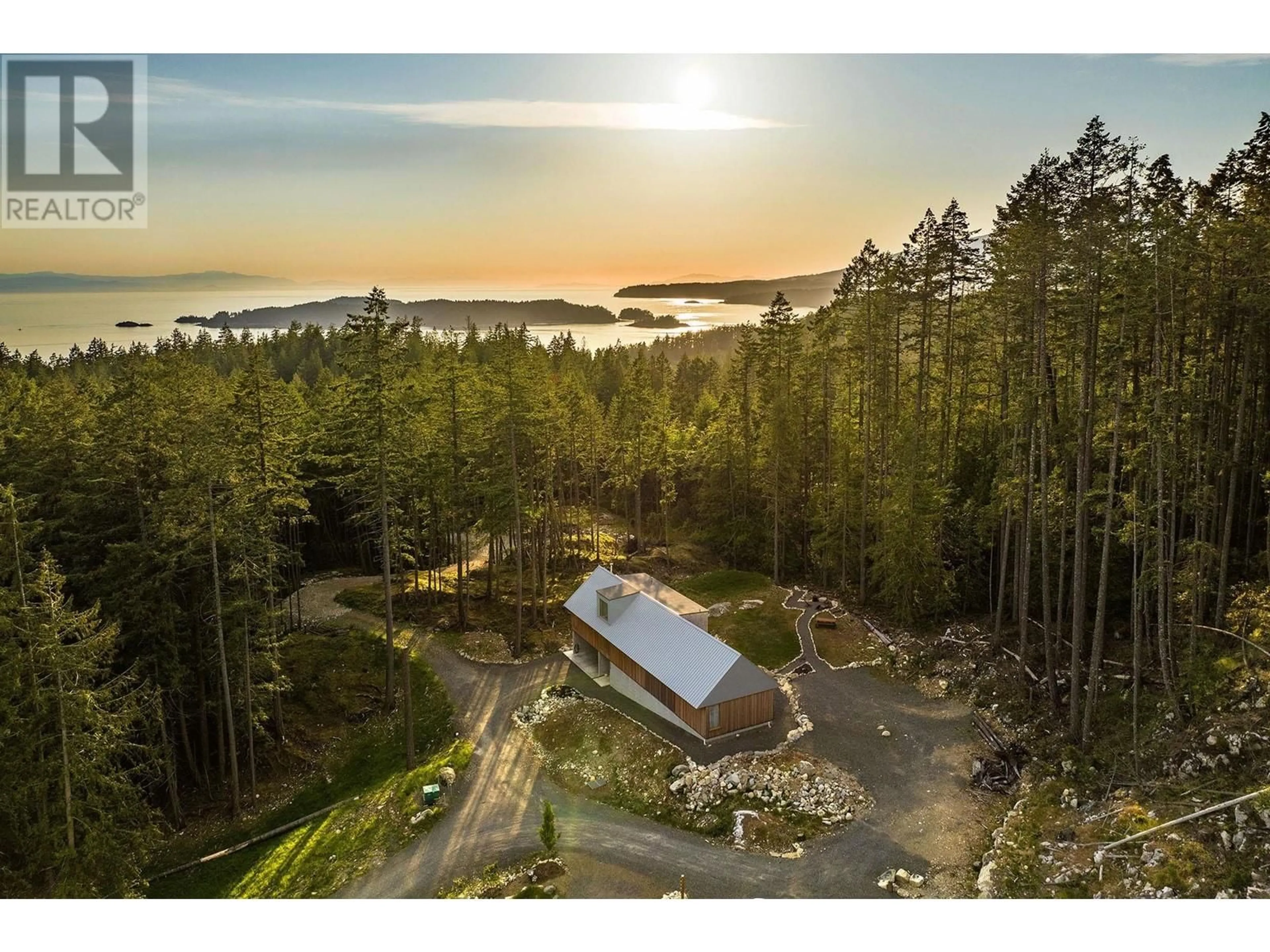 A pic from outside/outdoor area/front of a property/back of a property/a pic from drone, water/lake/river/ocean view for 1565 DOUGLAS ROAD, Bowen Island British Columbia V0N1G2