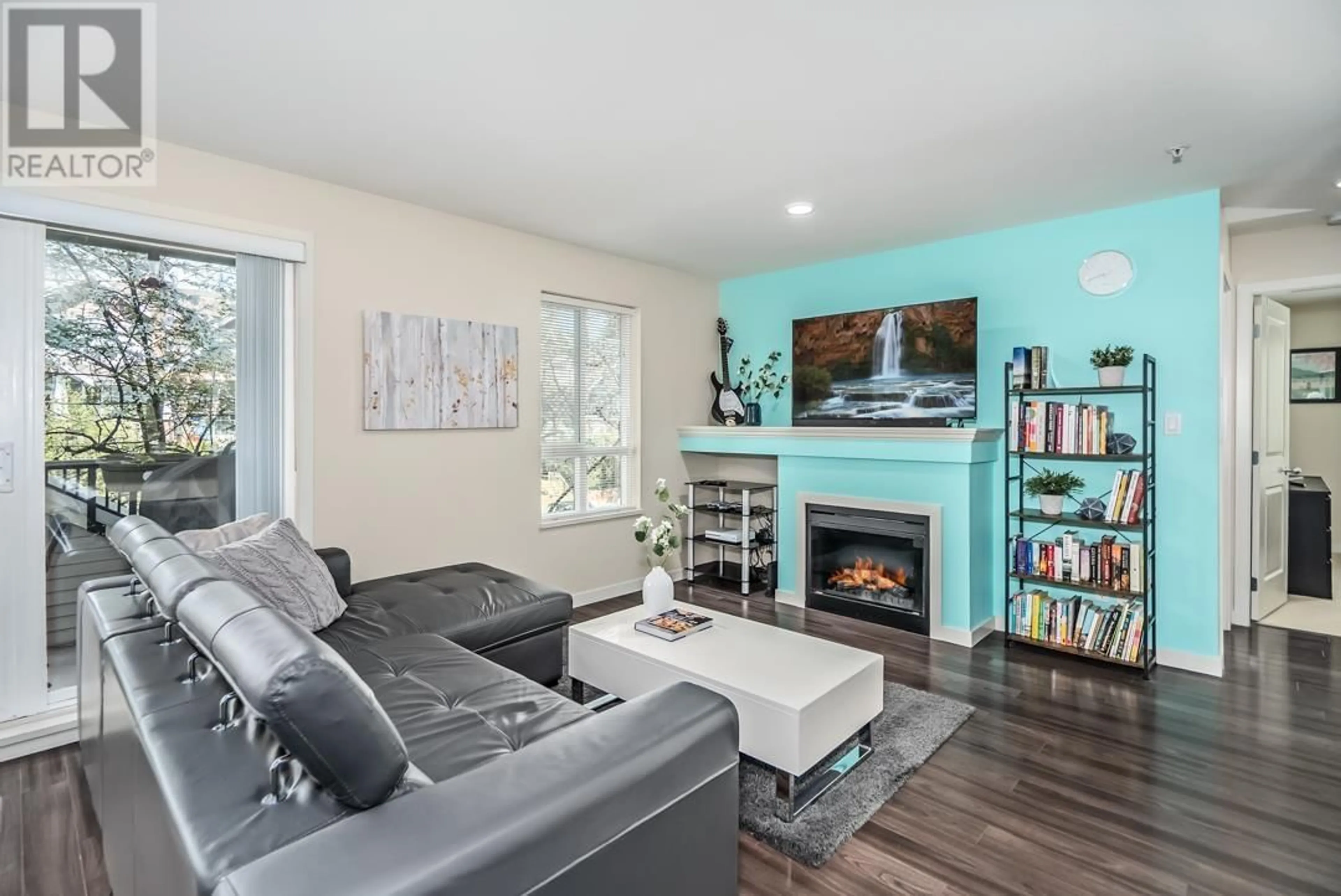 Living room with furniture, wood/laminate floor for 204 - 1576 GRANT AVENUE, Port Coquitlam British Columbia V3B1P2