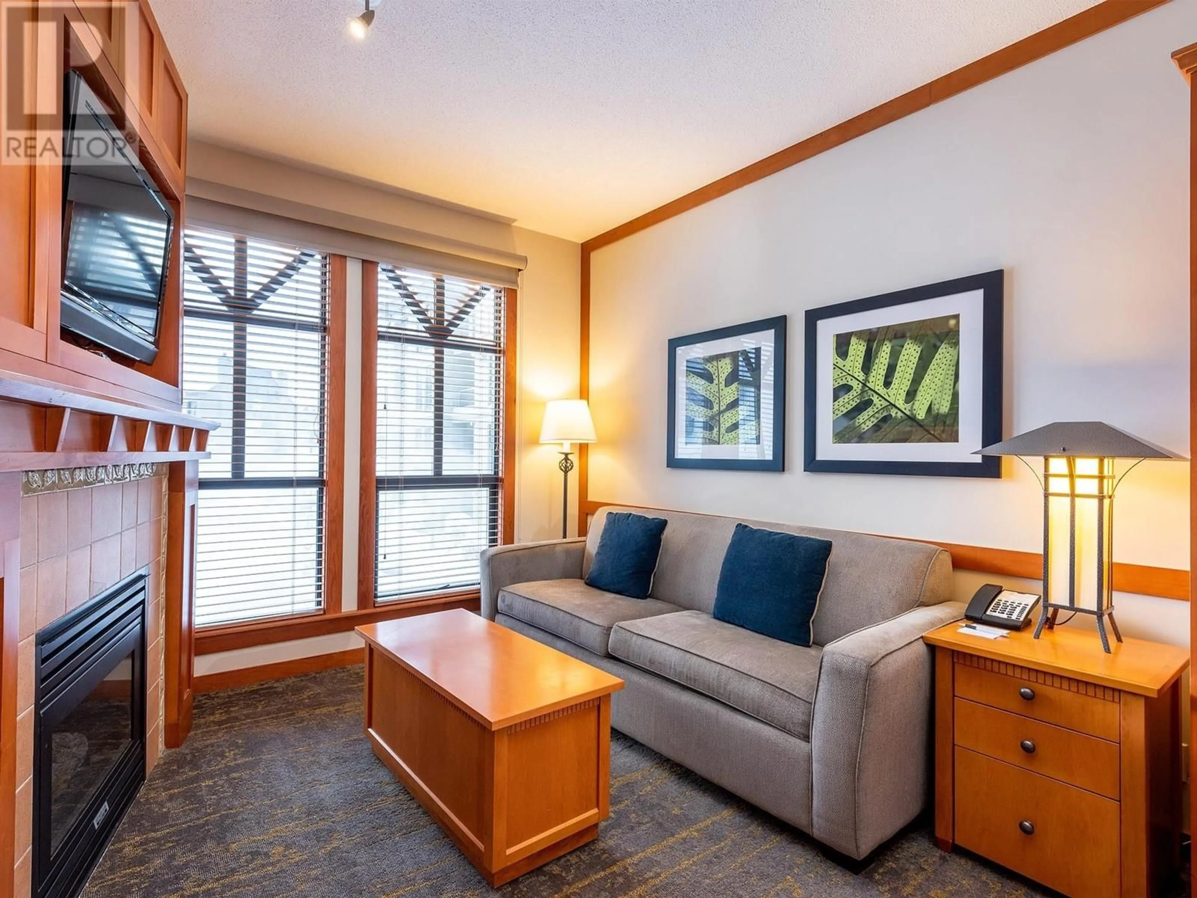 Living room with furniture, wood/laminate floor for 218 - 4320 SUNDIAL CRESCENT, Whistler British Columbia V8E1G6