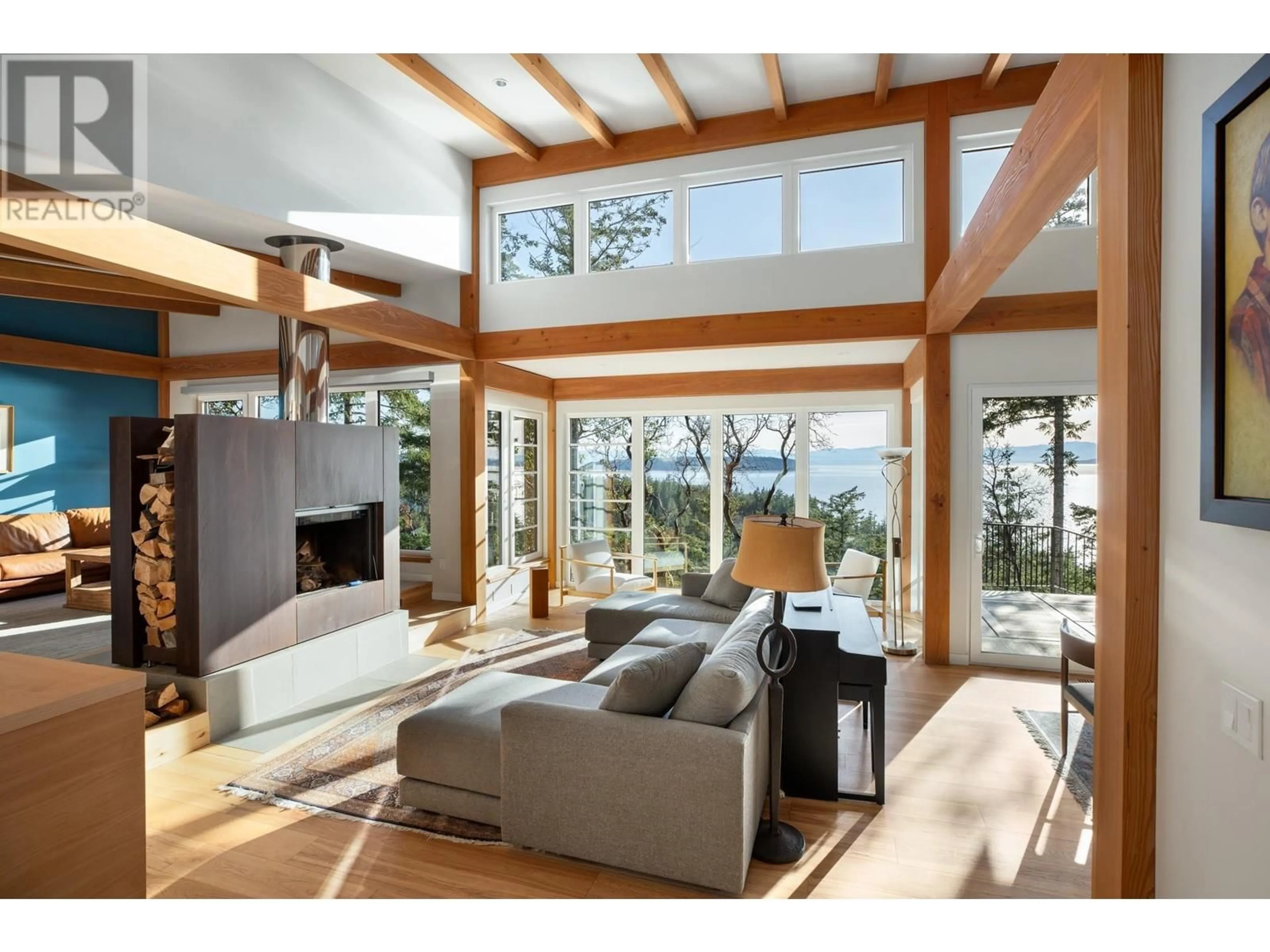 Living room with furniture, wood/laminate floor for 10635 WOOD BAY RIDGE ROAD, Halfmoon Bay British Columbia V7Z1B8