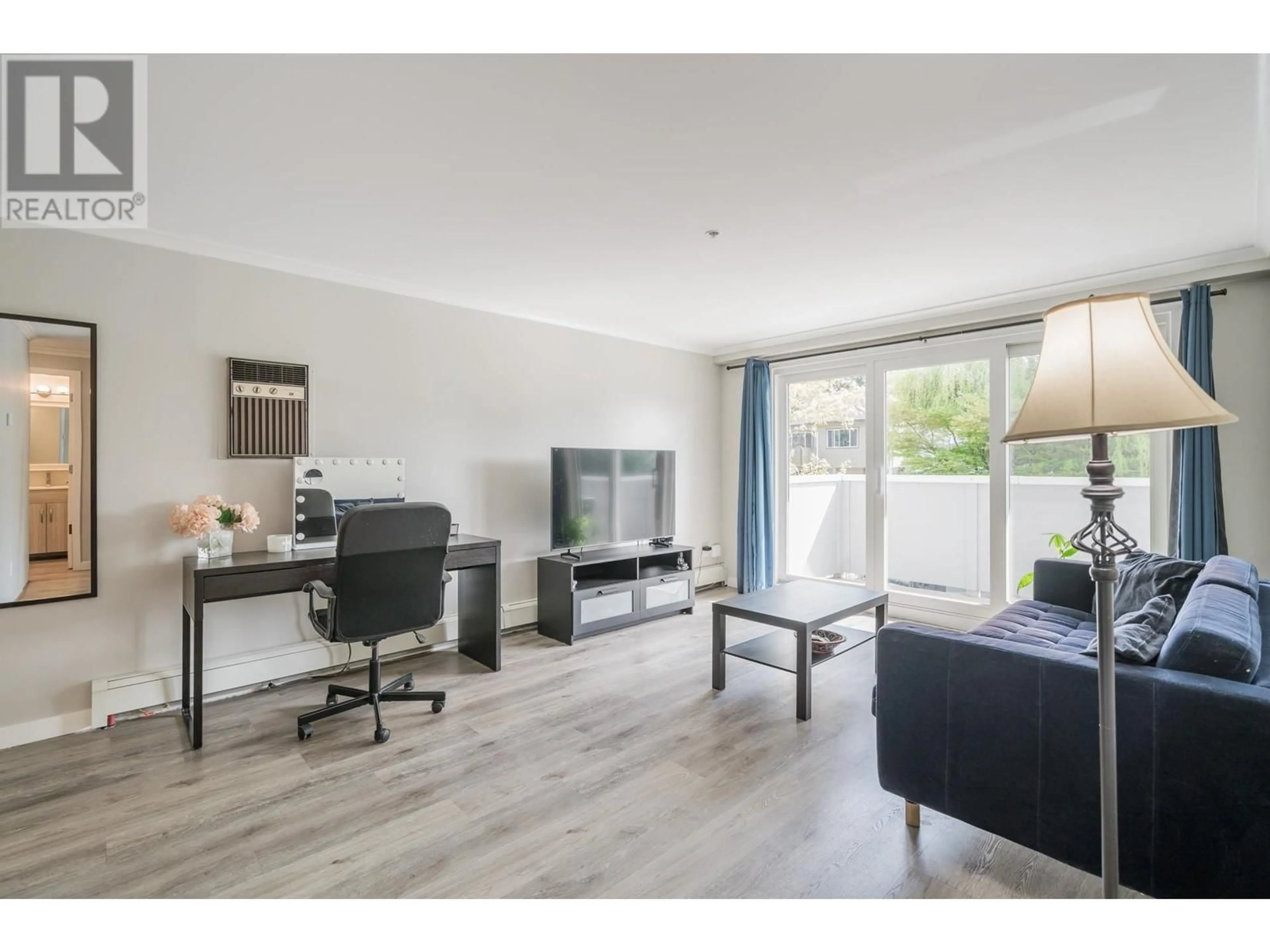 Living room with furniture, wood/laminate floor for 203 - 2036 COQUITLAM AVENUE, Port Coquitlam British Columbia V3B1J5