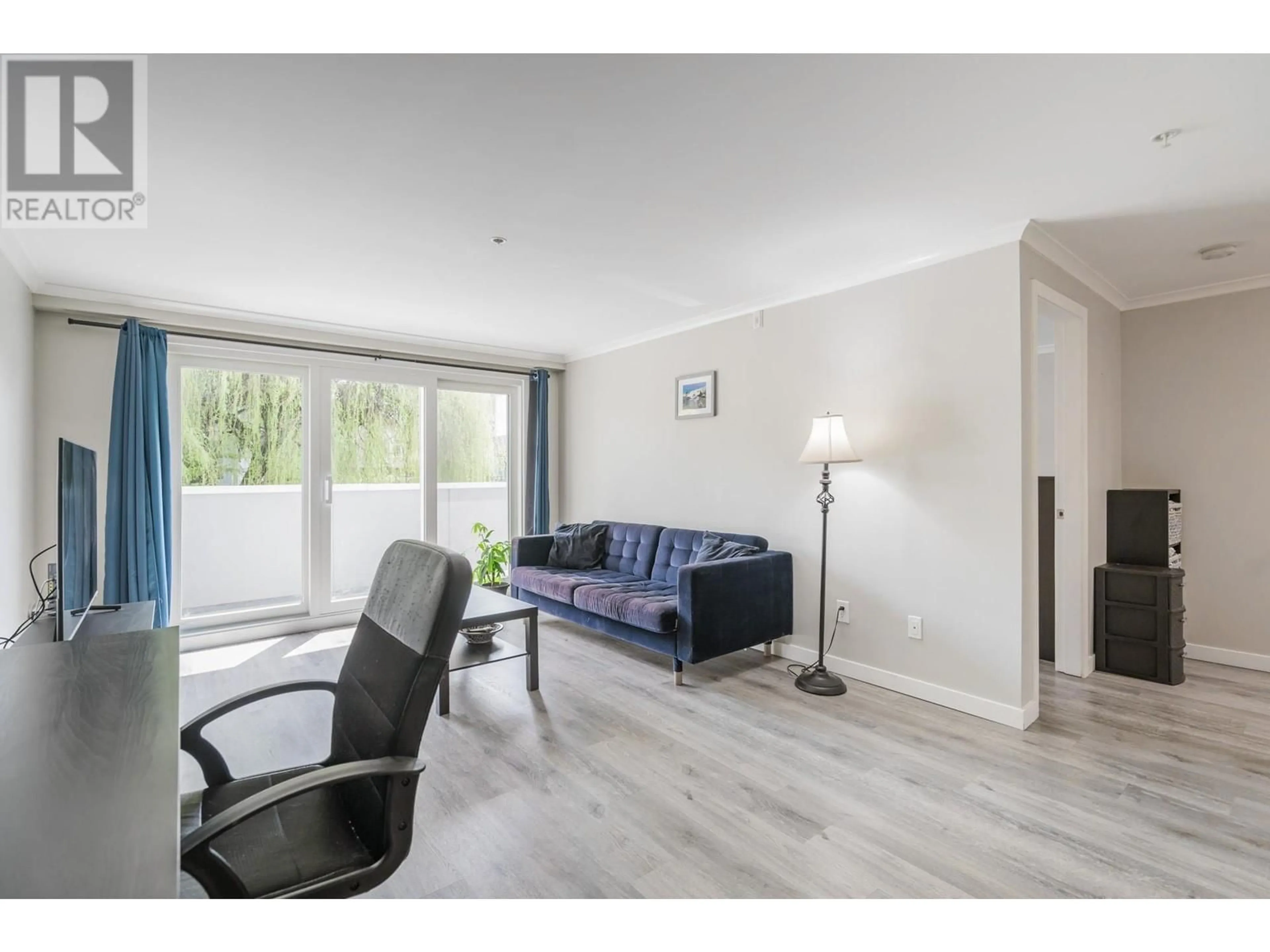 Living room with furniture, wood/laminate floor for 203 - 2036 COQUITLAM AVENUE, Port Coquitlam British Columbia V3B1J5